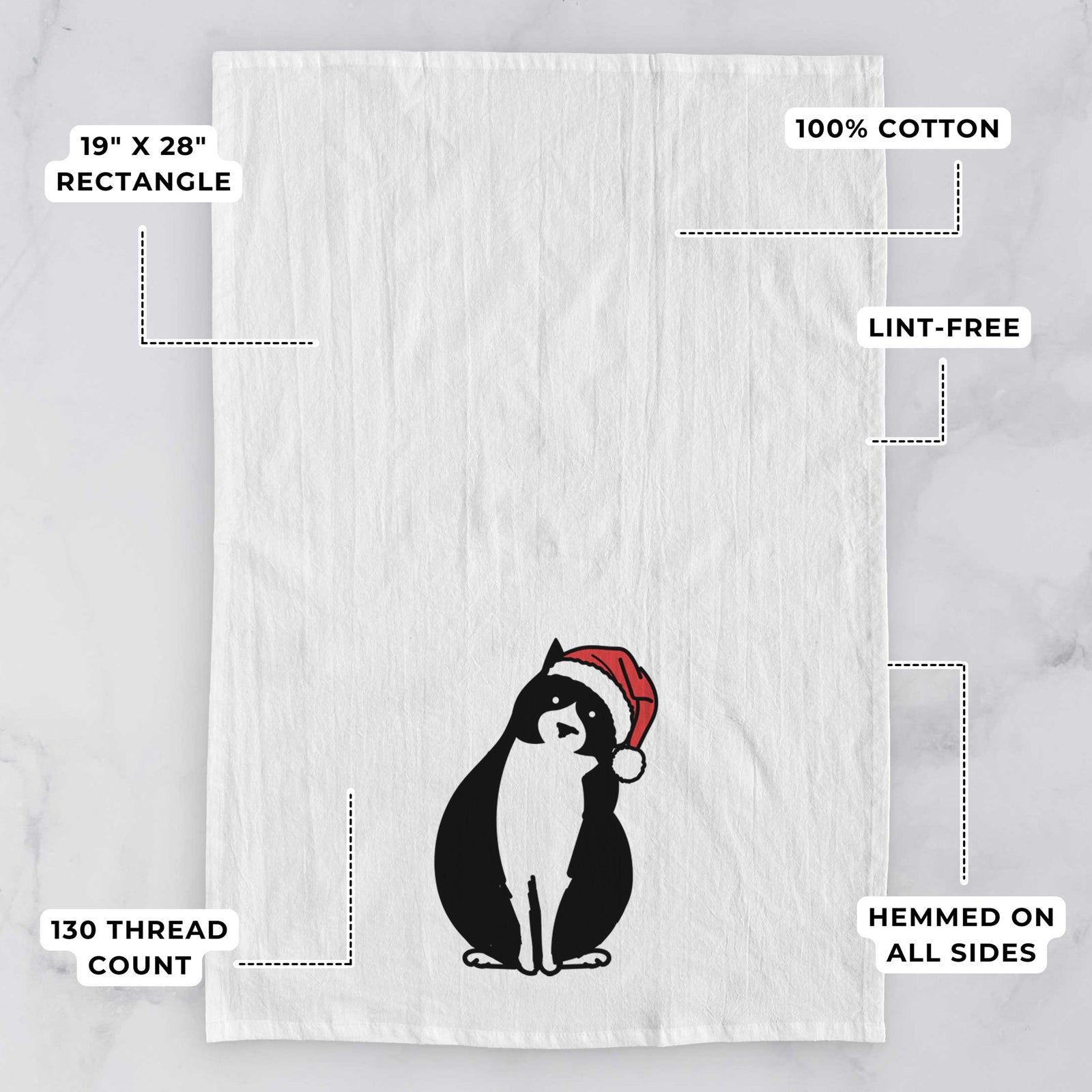 Minimalist line drawing of Oliver the Tuxedo Cat wearing a Santa hat on a tea towel, with feature callouts: 19 x 28 inch rectangle, 100% cotton, lint-free, 120 thread count, hemmed on all sides