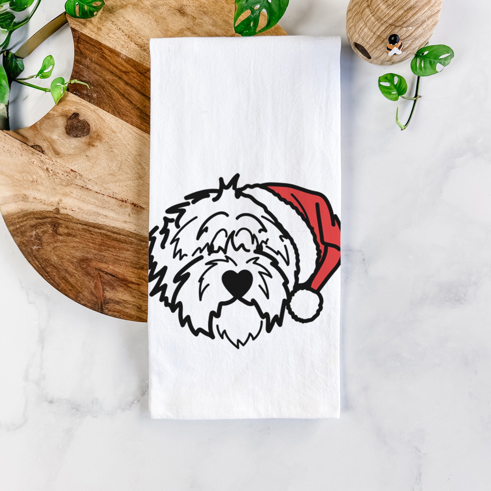 Minimalist line drawing of Penny the Old English Sheepdog wearing a Santa hat on a tea towel