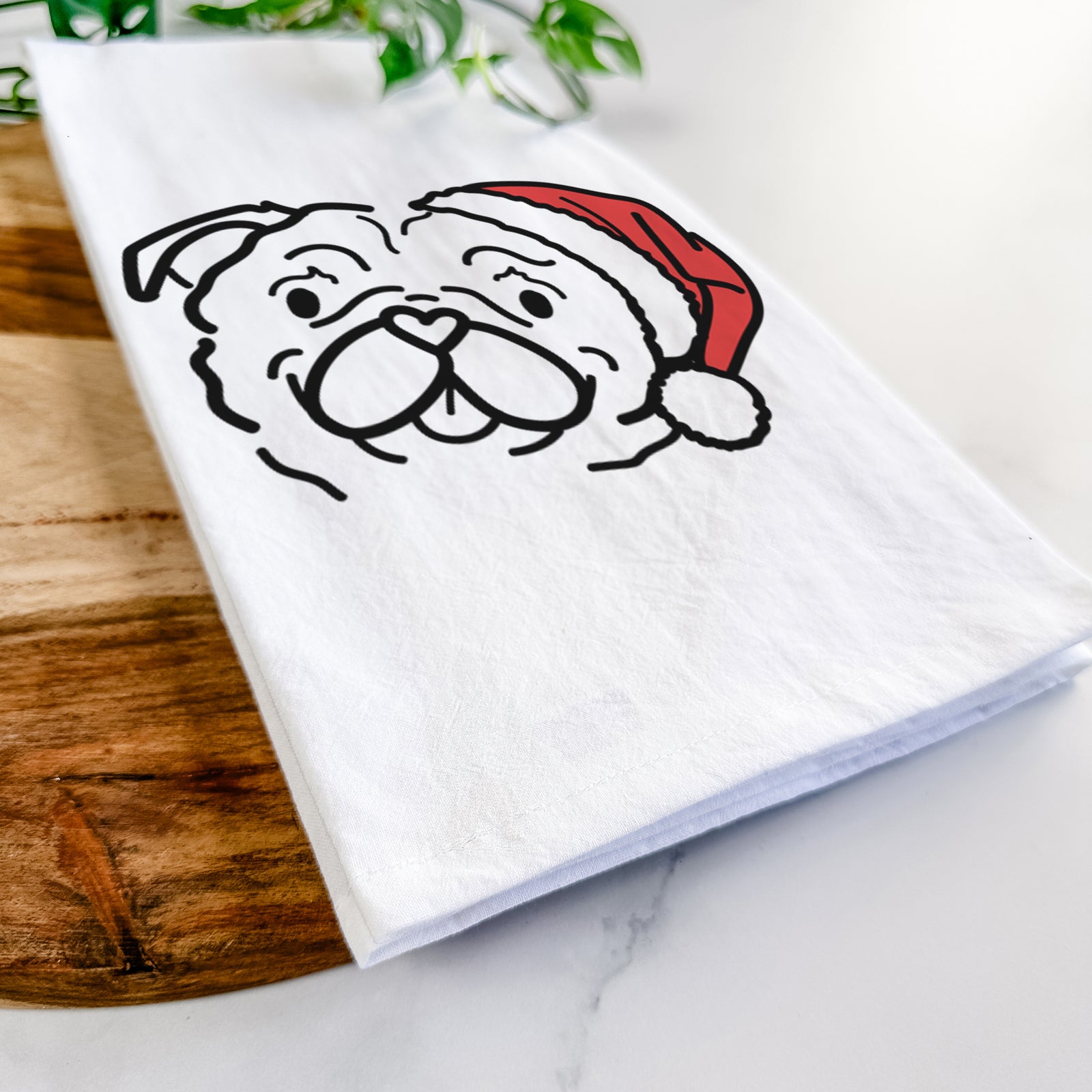 Minimalist line drawing of Pip the Pug wearing a Santa hat on a tea towel