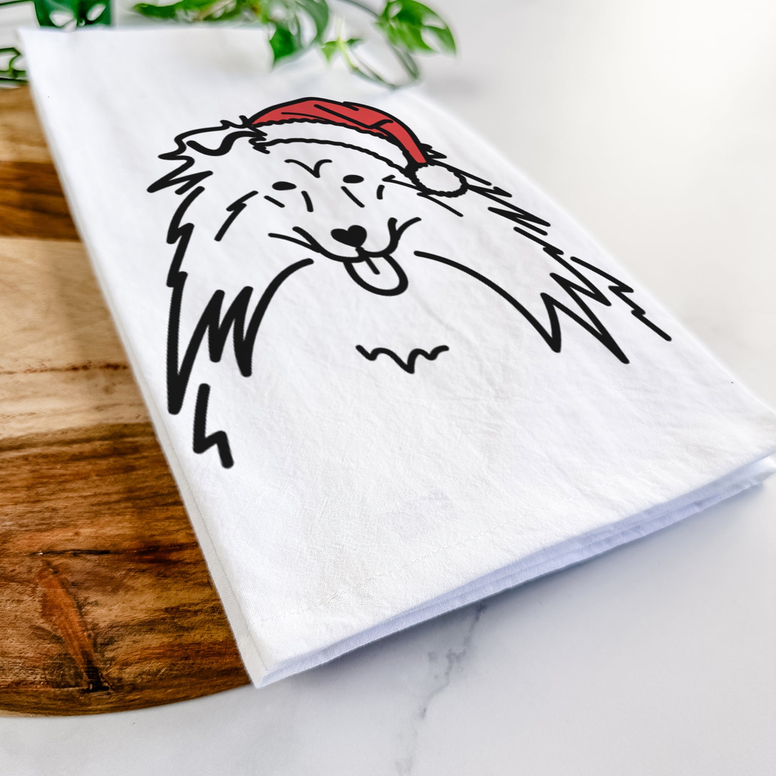 Minimalist line drawing of a Rough Collie wearing a Santa hat on a tea towel