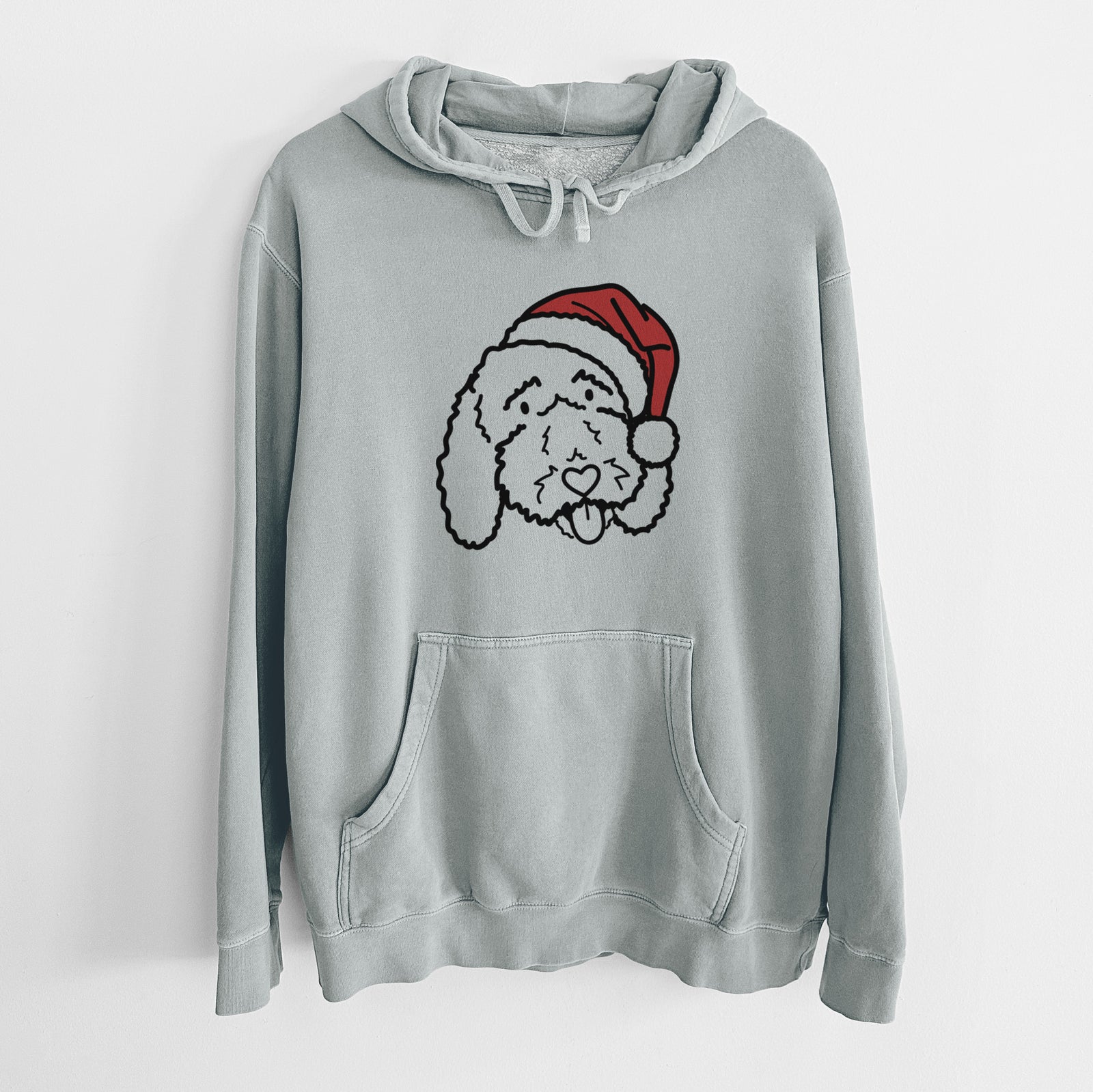 Minimalist line drawing of Ruby the Bernedoodle wearing a Santa hat on a Sage Unisex pigment dyed hoodie