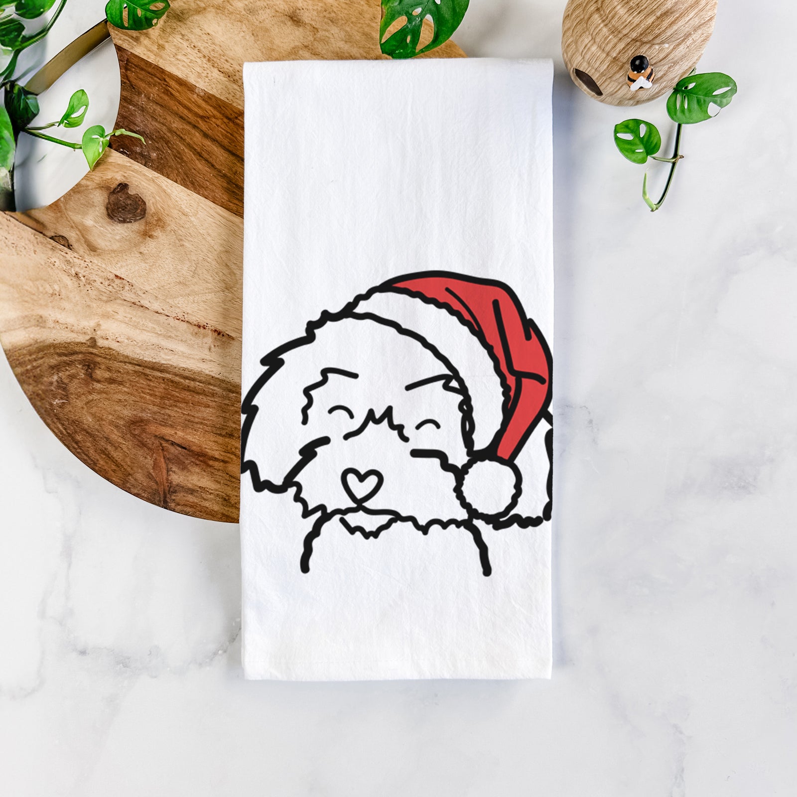 Minimalist line drawing of a Schnoodle wearing a Santa hat on a tea towel