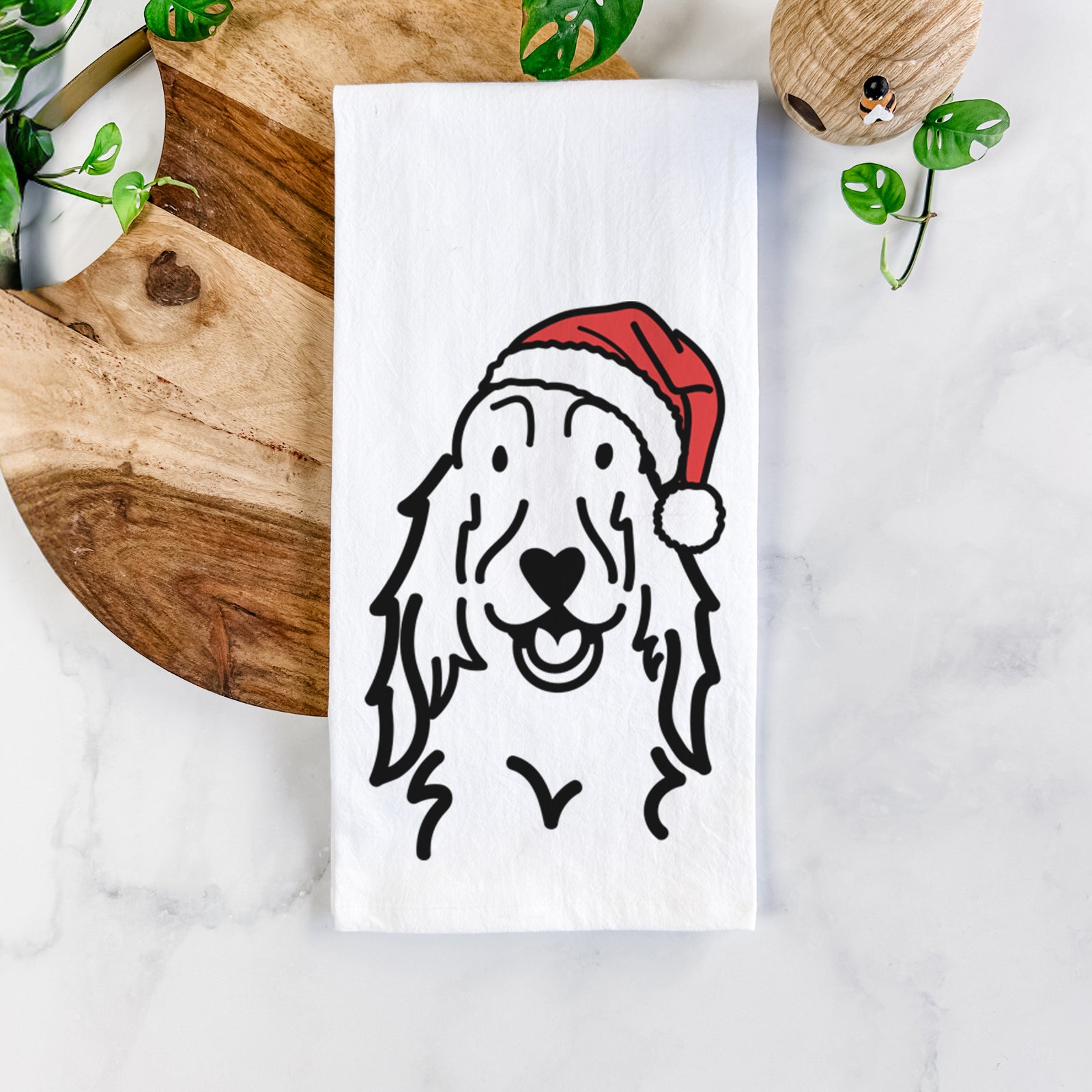 Minimalist line drawing of a Setter wearing a Santa hat on a tea towel