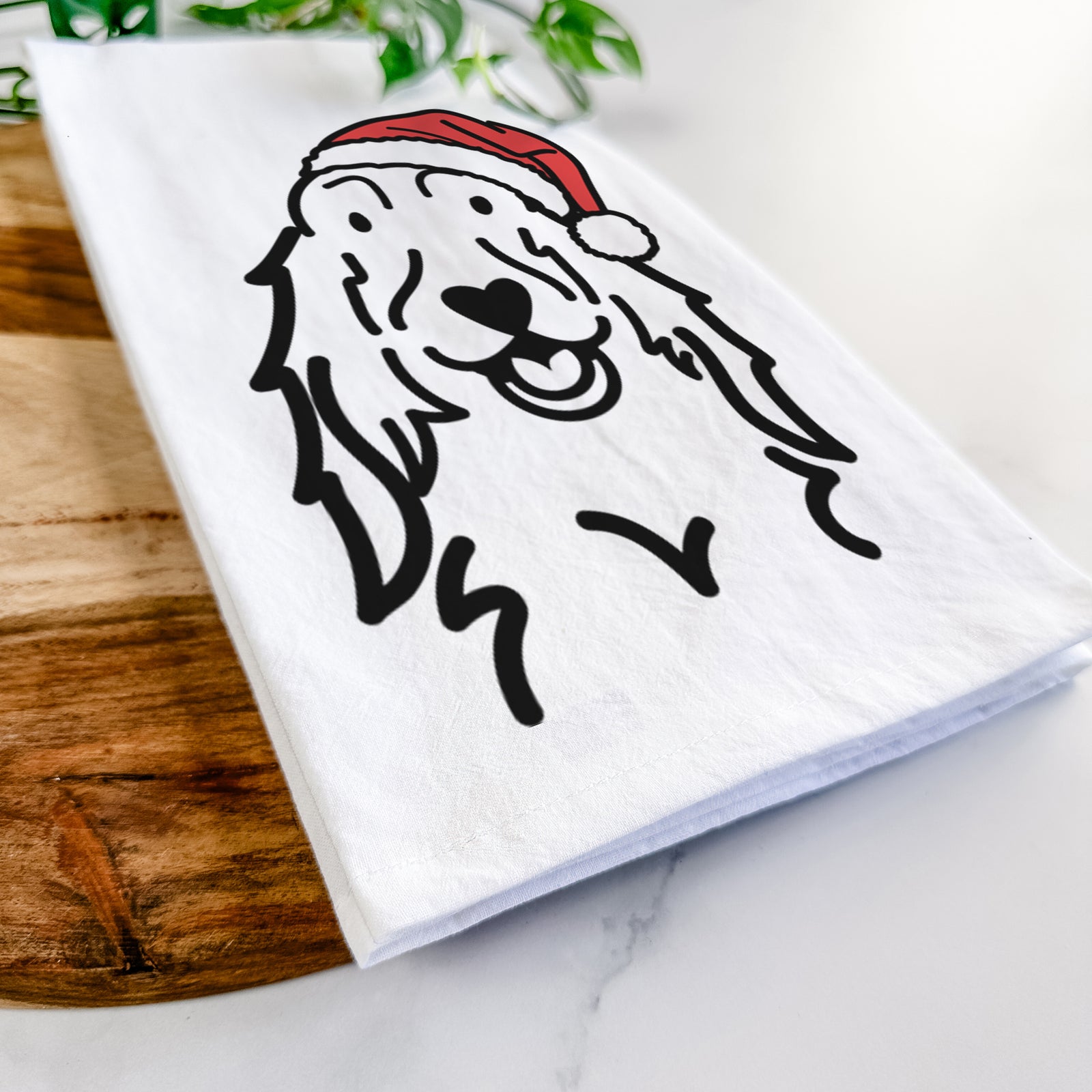 Minimalist line drawing of a Setter wearing a Santa hat on a tea towel