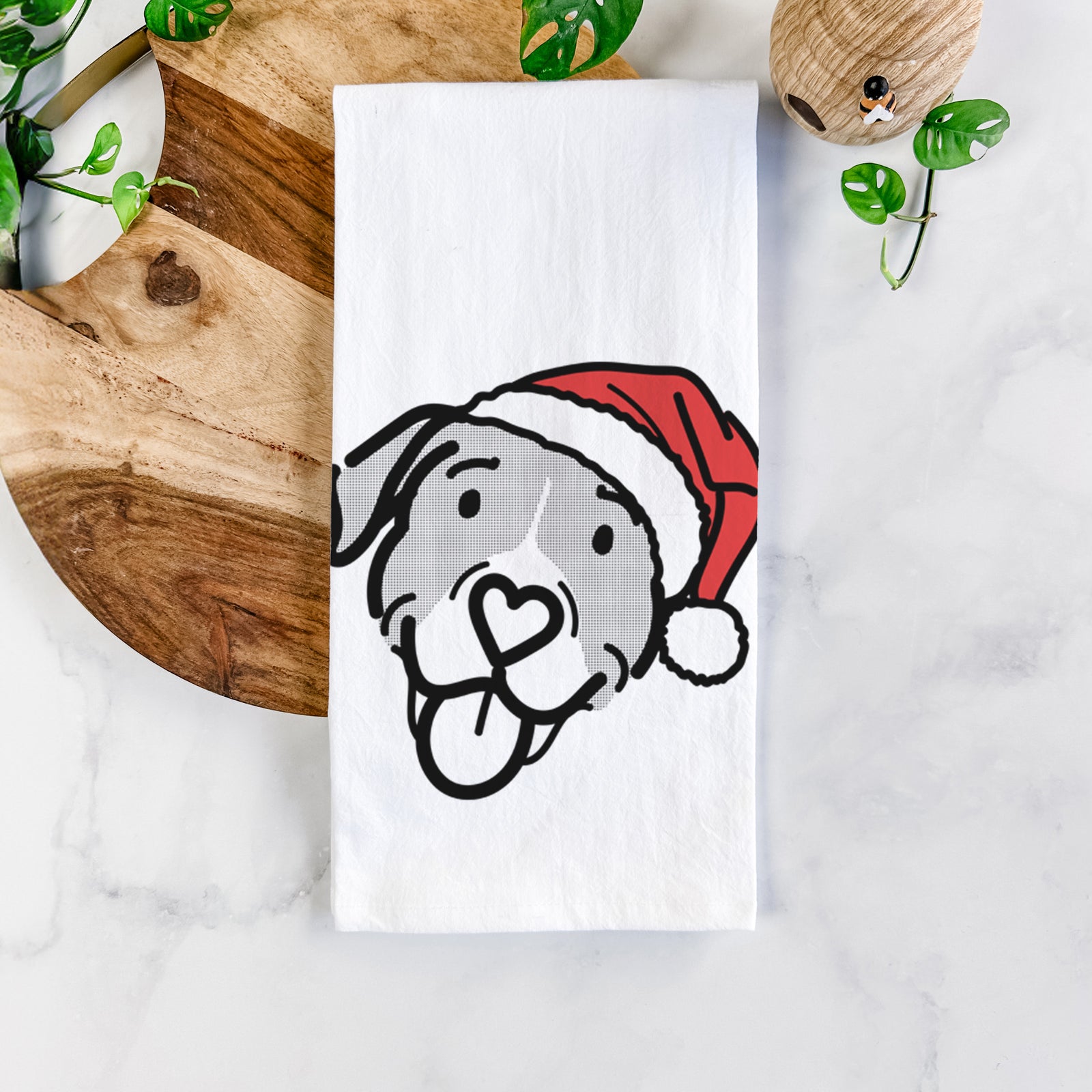 Minimalist line drawing of Shadow the Pitbull Mix wearing a Santa hat on a tea towel