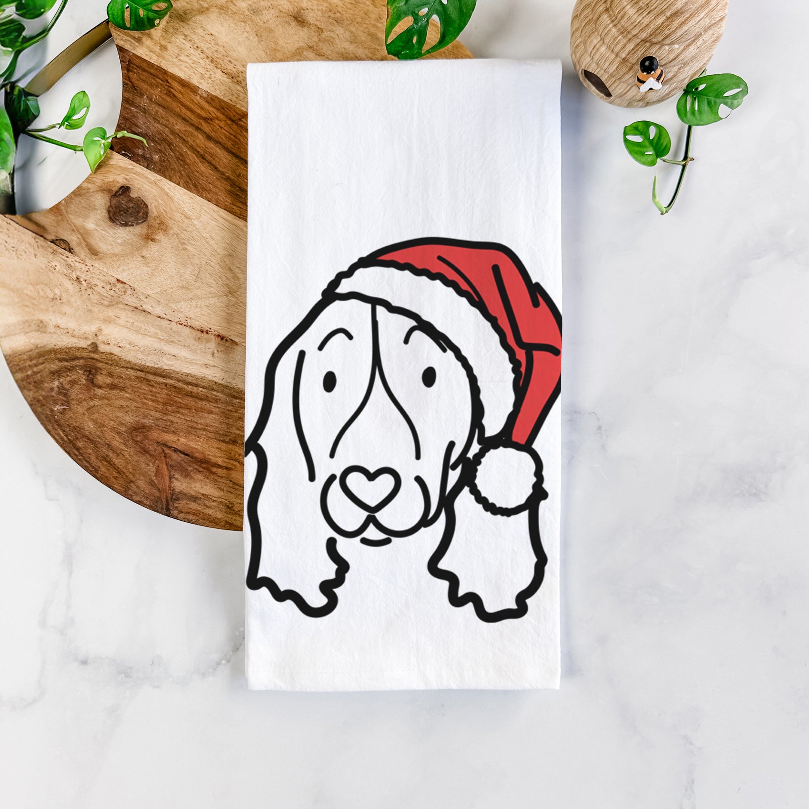 Minimalist line drawing of an English Springer Spaniel wearing a Santa hat on a tea towel