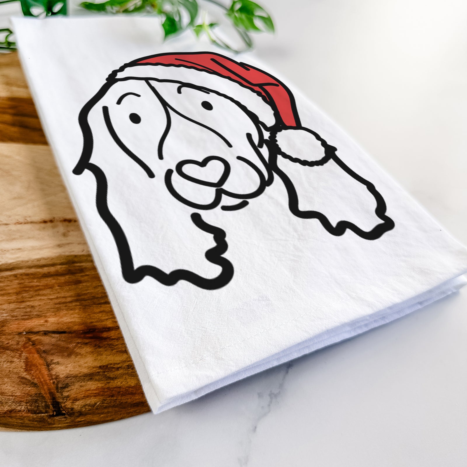 Minimalist line drawing of an English Springer Spaniel wearing a Santa hat on a tea towel