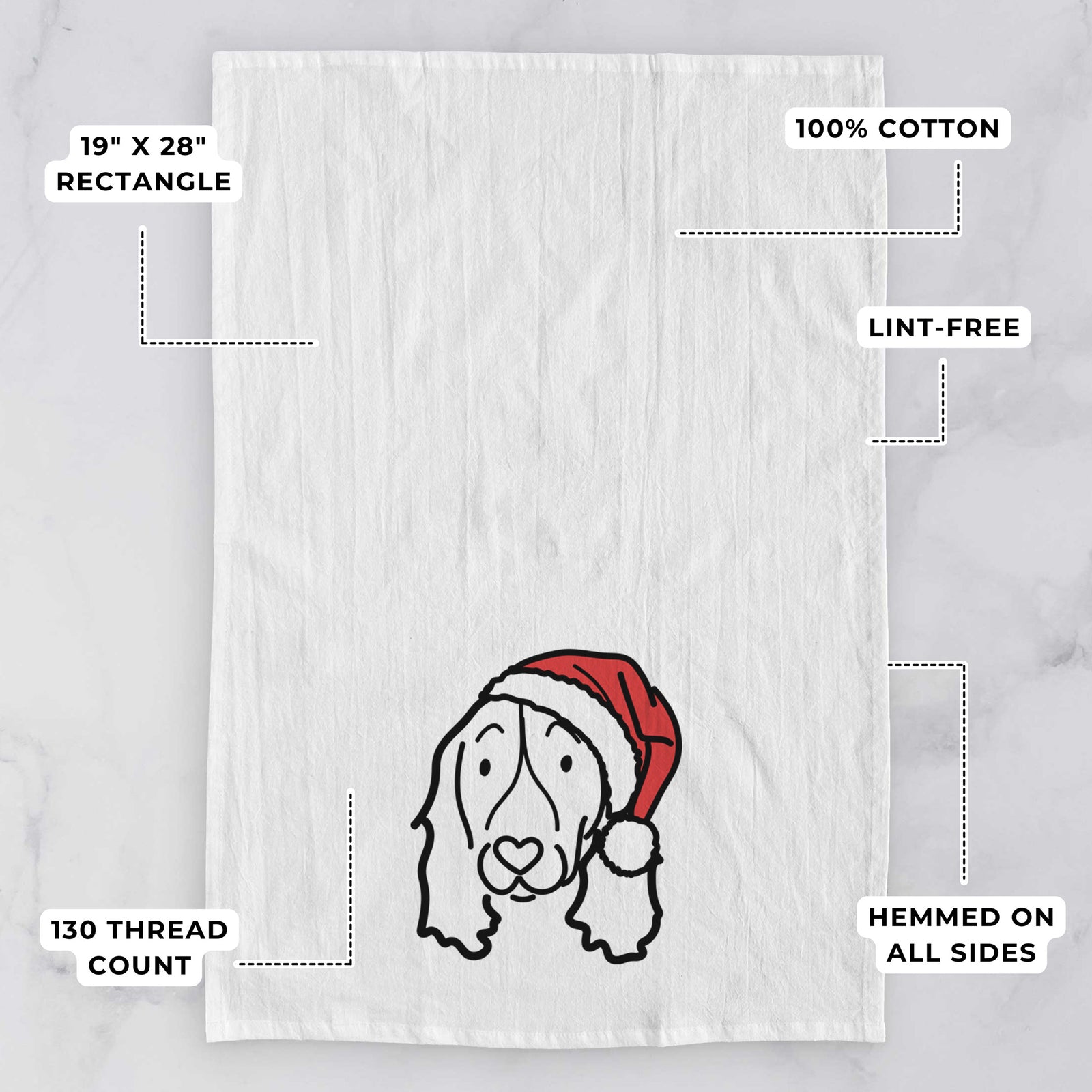 Minimalist line drawing of an English Springer Spaniel wearing a Santa hat on a tea towel, with feature callouts: 19 x 28 inch rectangle, 100% cotton, lint-free, 120 thread count, hemmed on all sides