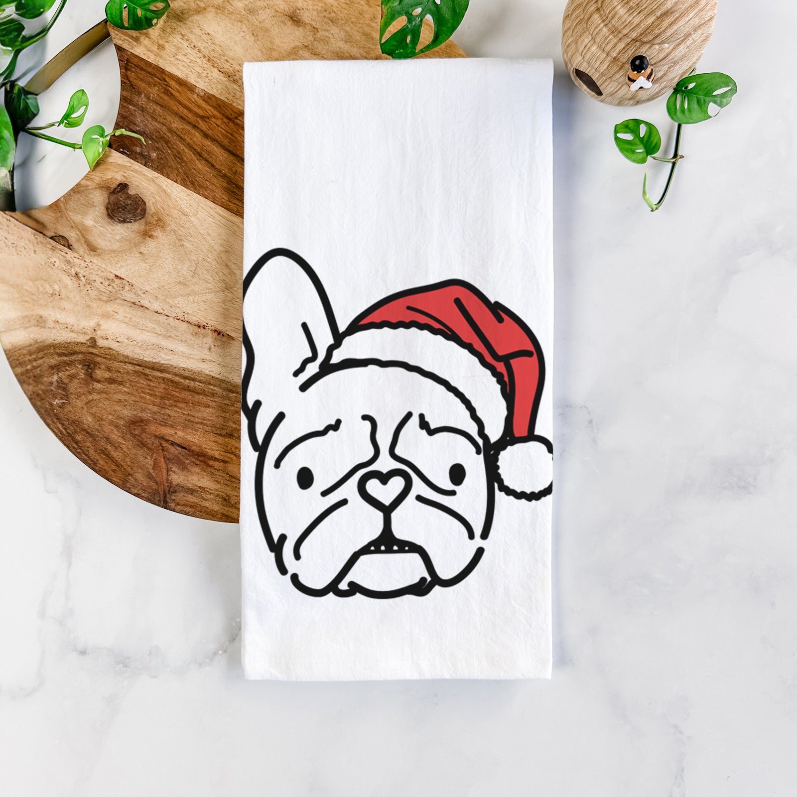 Minimalist line drawing of Squishy the French Bulldog wearing a Santa hat on a tea towel