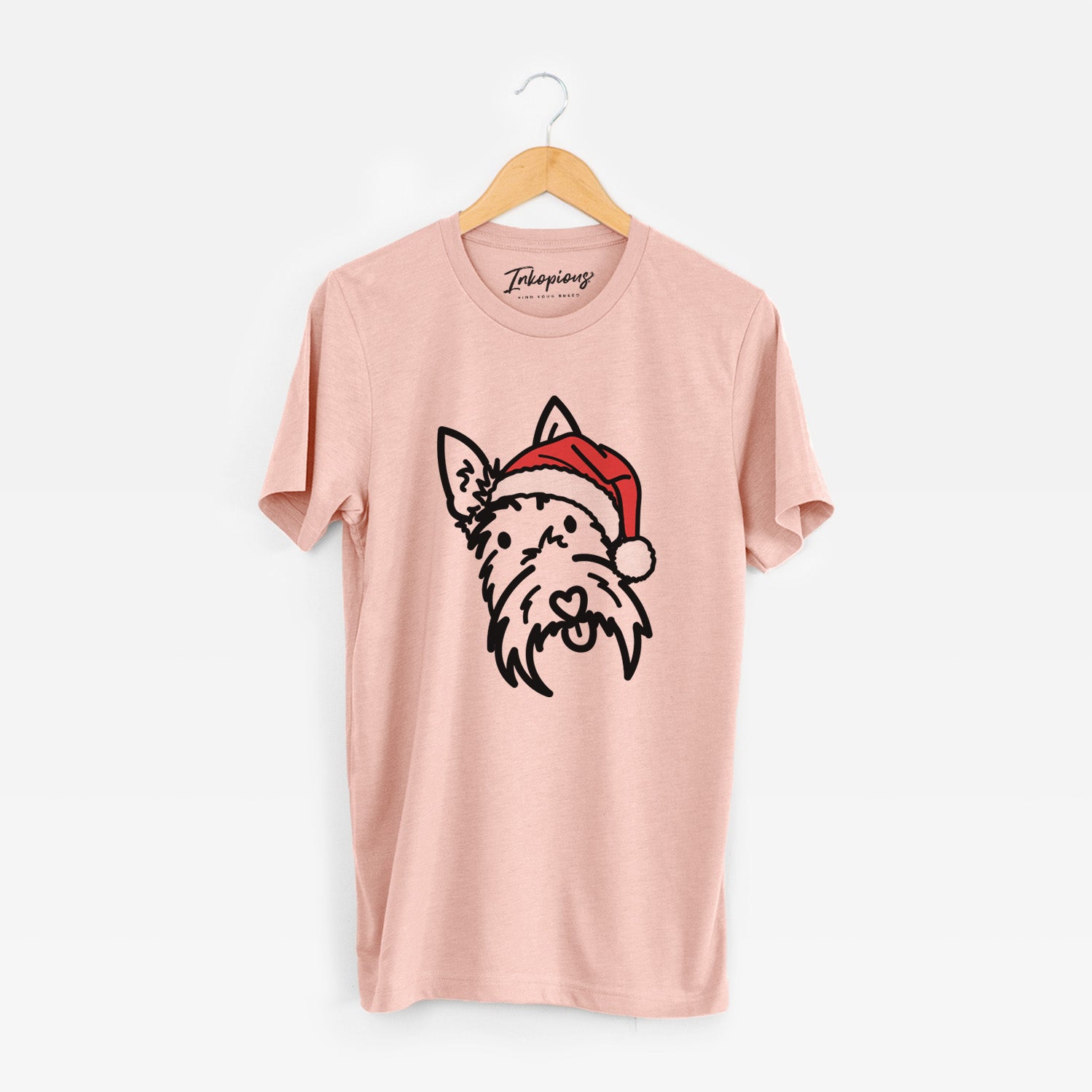 Minimalist line drawing of Thistle the Scottish Terrier wearing a Santa hat on a Peach Unisex crewneck