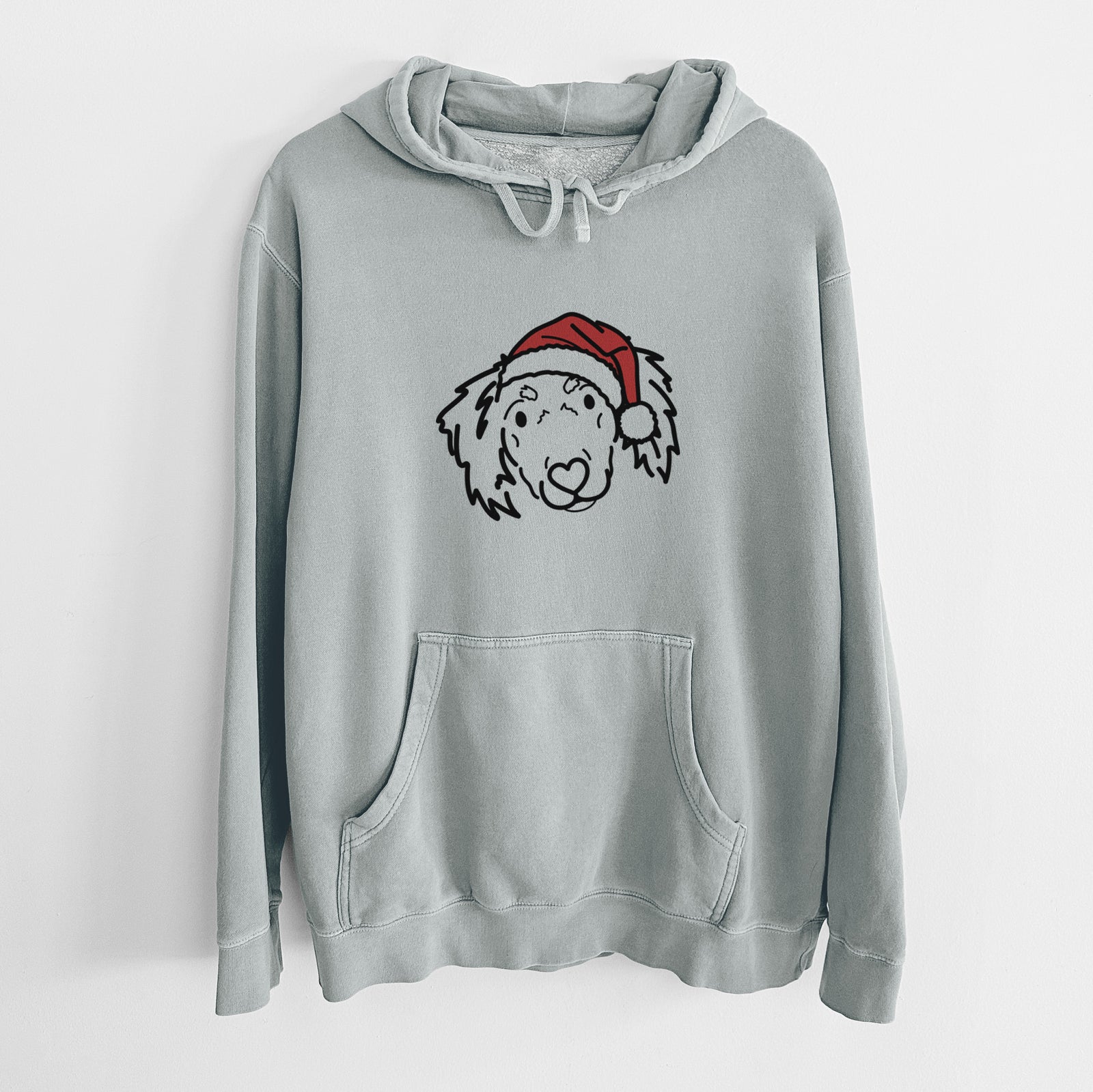 Minimalist line drawing of Tilly the Dachshund Mix wearing a Santa hat on a Sage Unisex pigment dyed hoodie