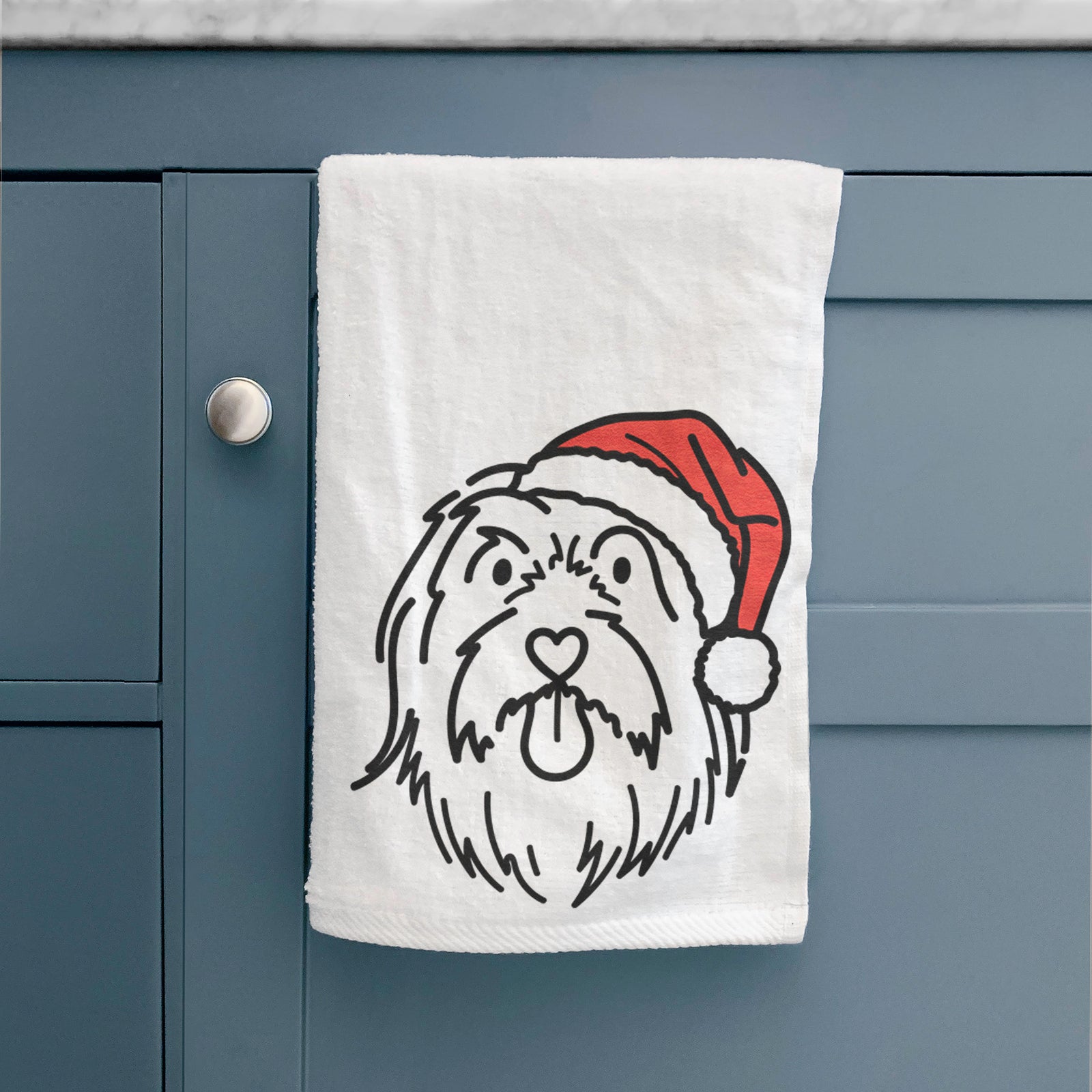 Minimalist line drawing of Tucker the Bearded Collie wearing a Santa hat on a decorative hand towel