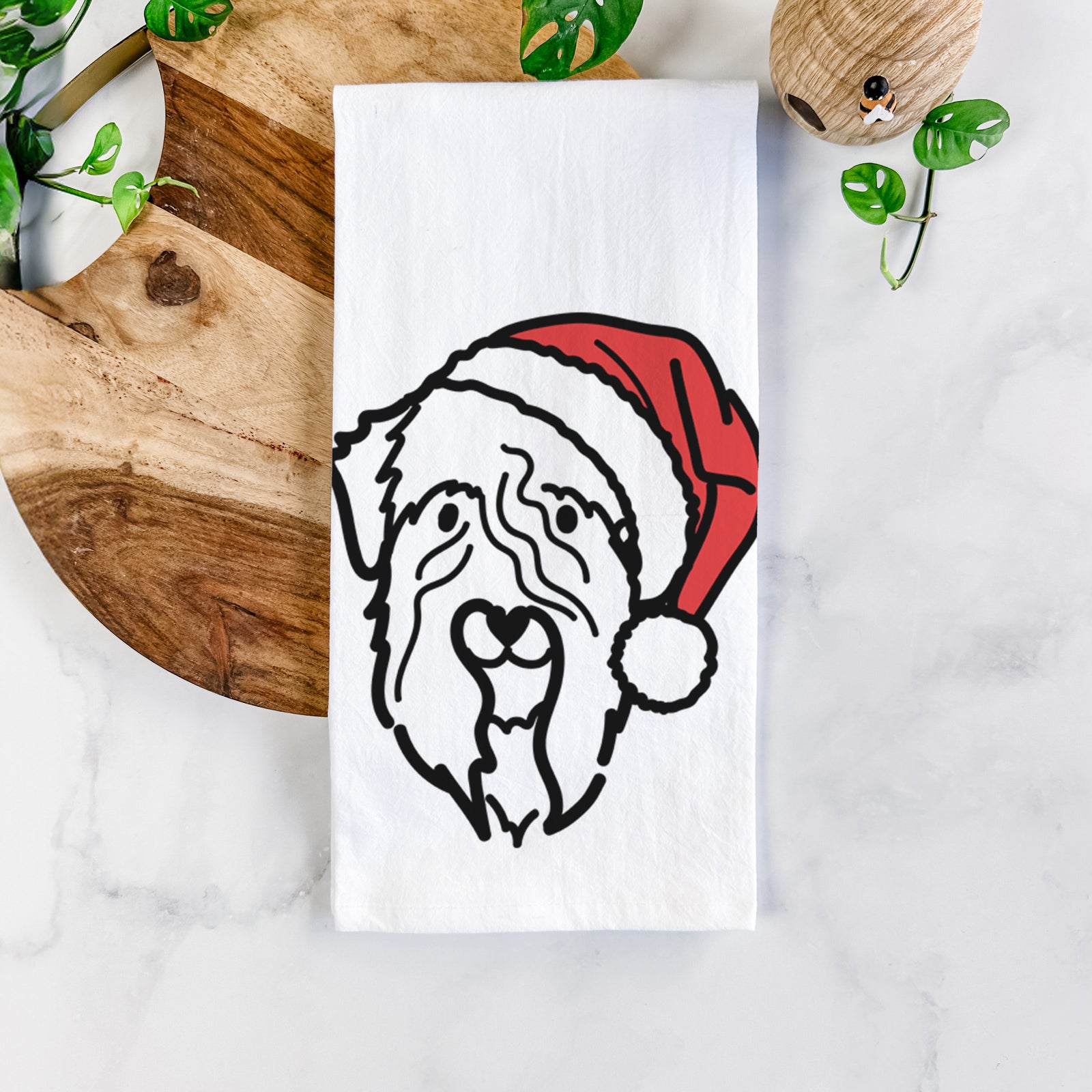 Minimalist line drawing of a Soft Coated Wheaten Terrier wearing a Santa hat on a tea towel