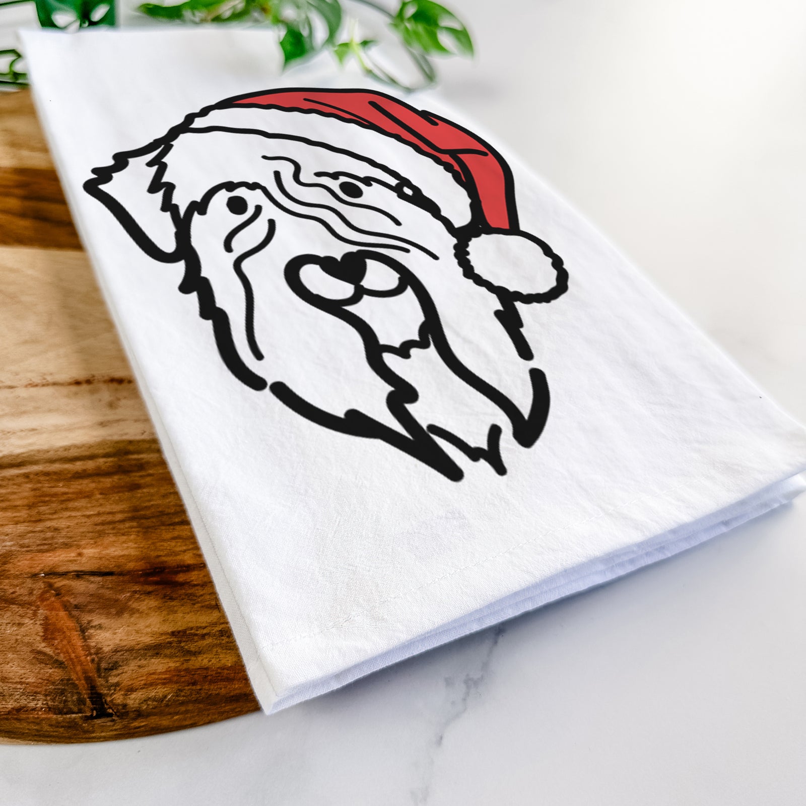 Minimalist line drawing of a Soft Coated Wheaten Terrier wearing a Santa hat on a tea towel