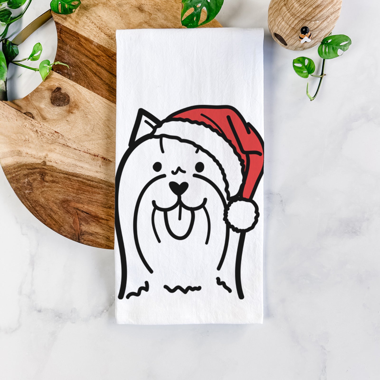 Minimalist line drawing of a Yorkshire Terrier wearing a Santa hat on a tea towel