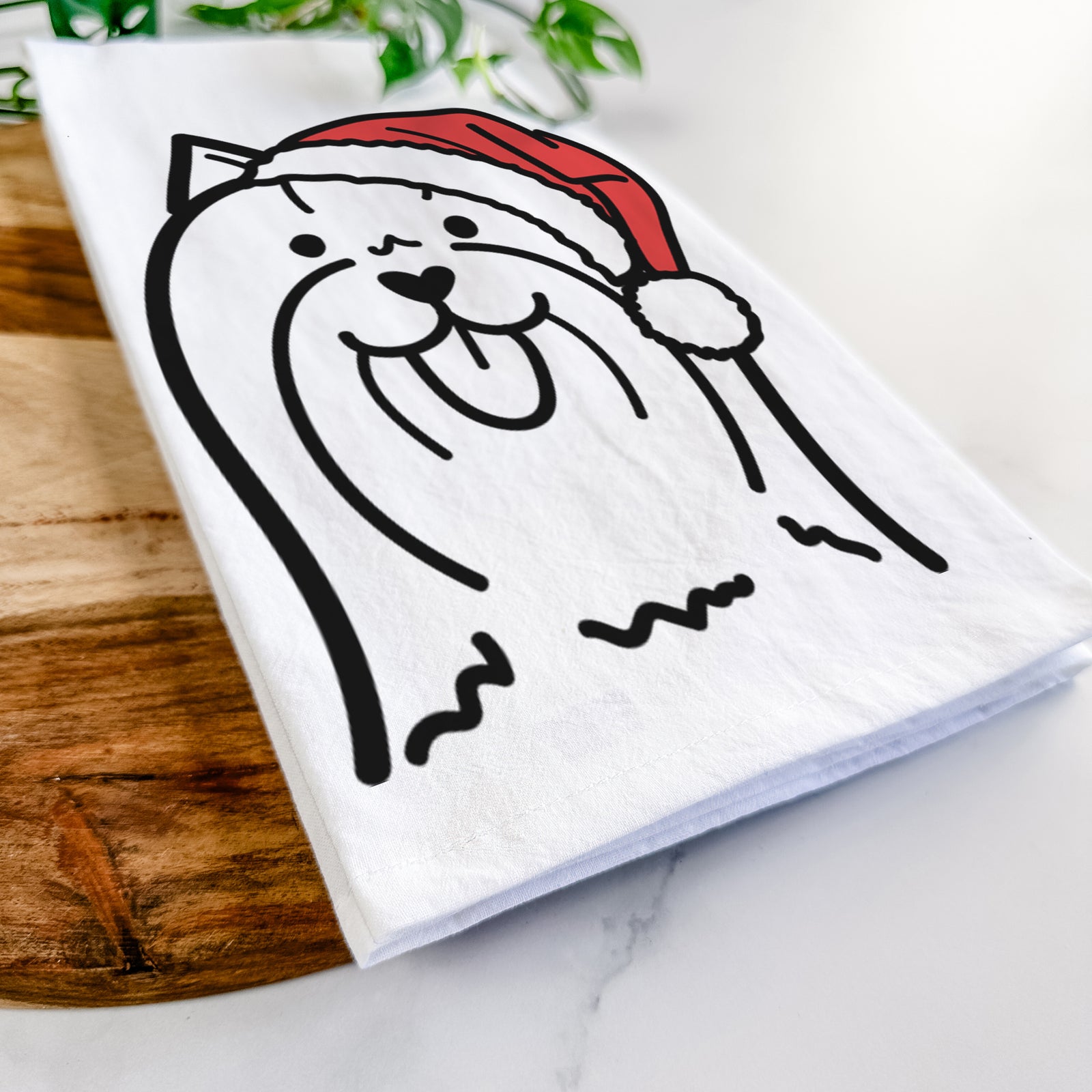 Minimalist line drawing of a Yorkshire Terrier wearing a Santa hat on a tea towel