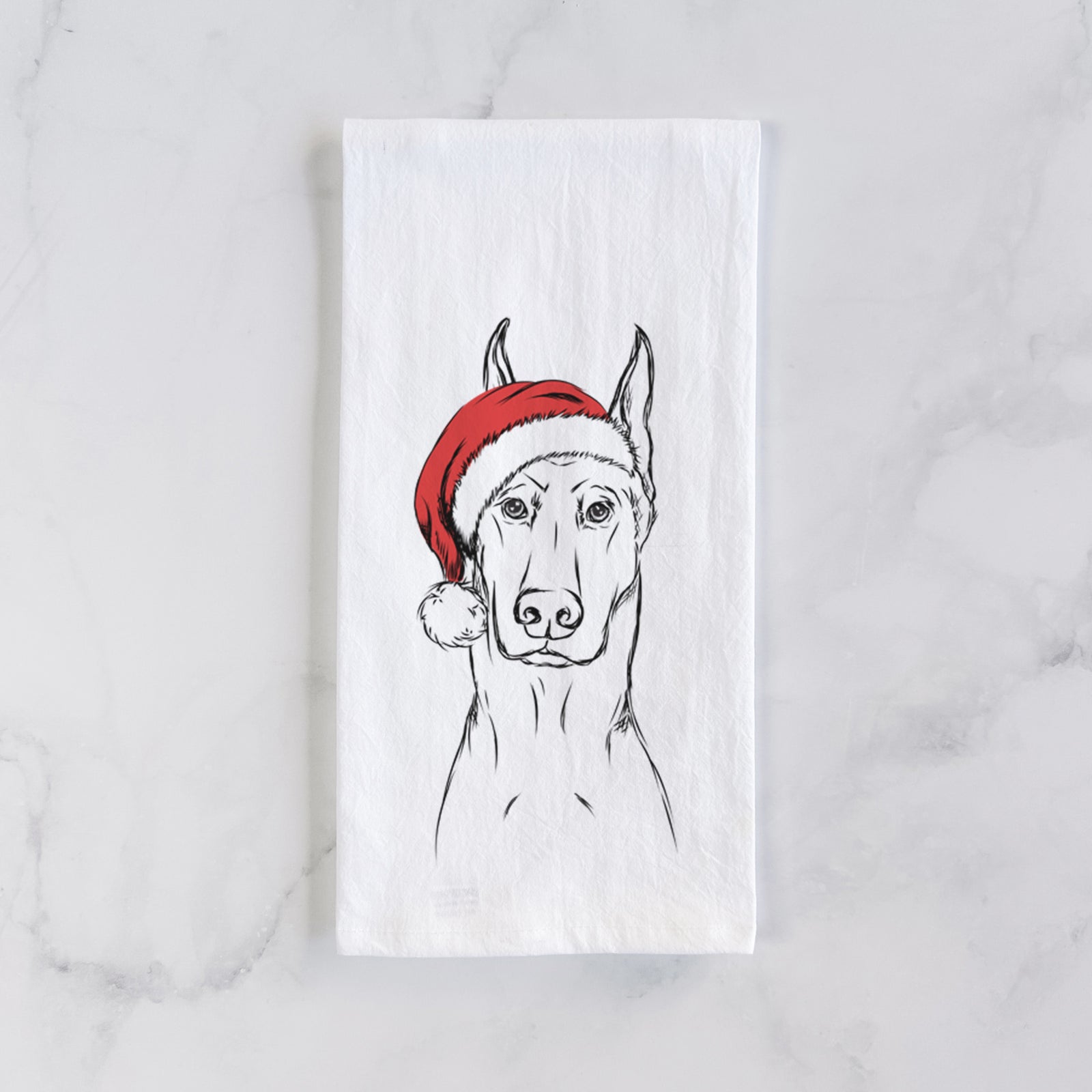 Hand-drawn sketch of Ace the Doberman Pinscher wearing a Santa hat on a tea towel