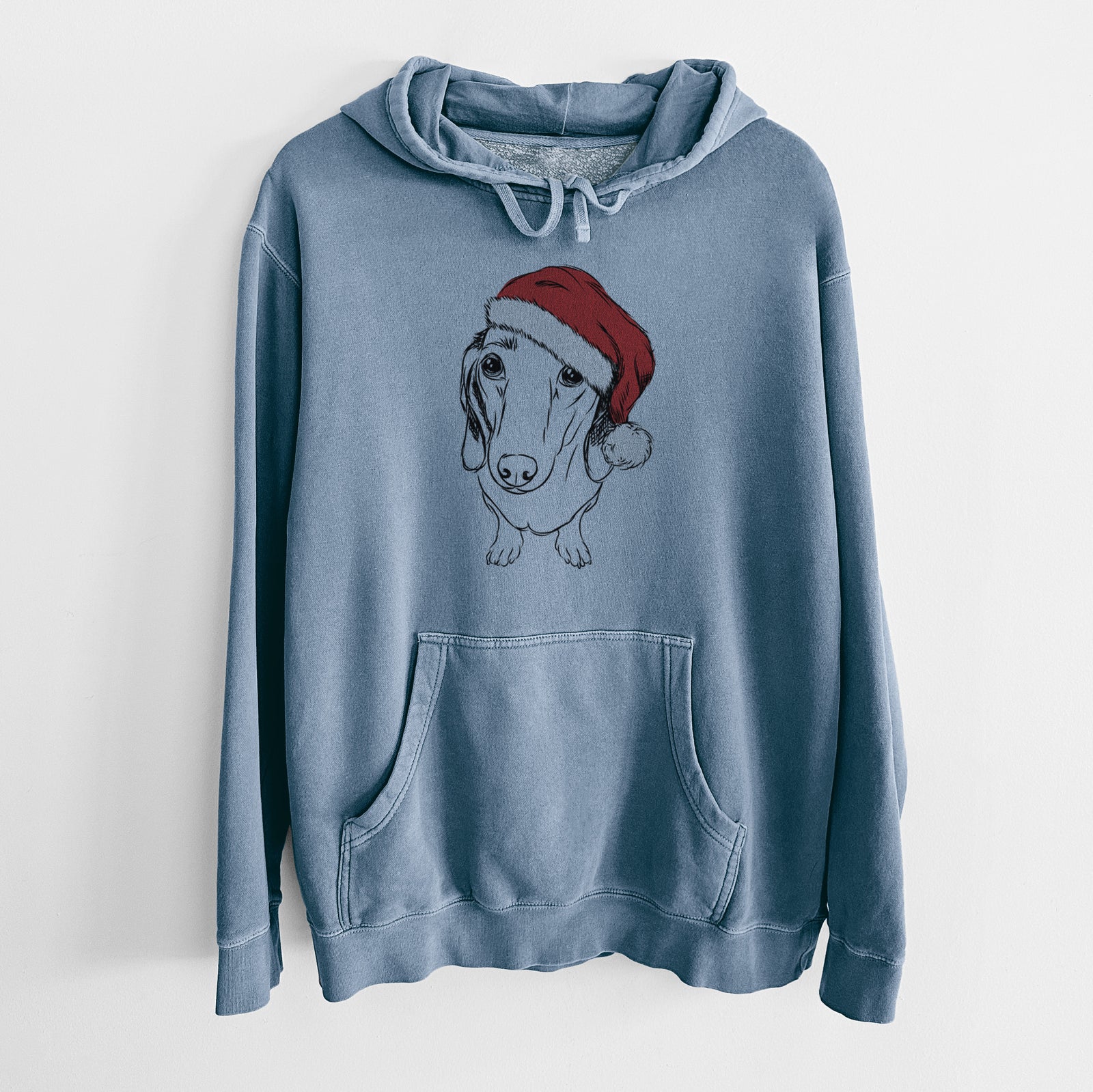 Hand-drawn sketch of Annabelle the Dachshund wearing a Santa hat on a Slate Blue Unisex pigment dyed hoodie