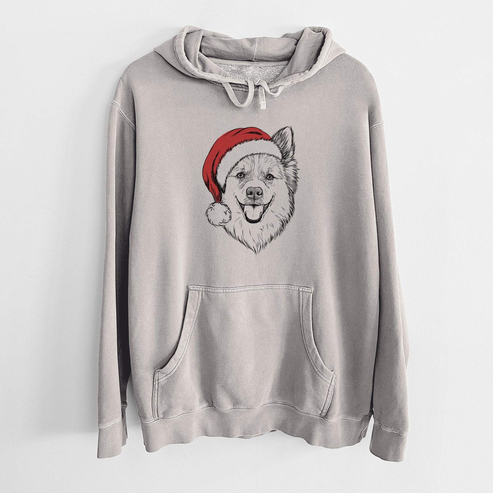 Hand-drawn sketch of Ari the Icelandic Sheepdog wearing a Santa hat on a Cement Unisex pigment dyed hoodie