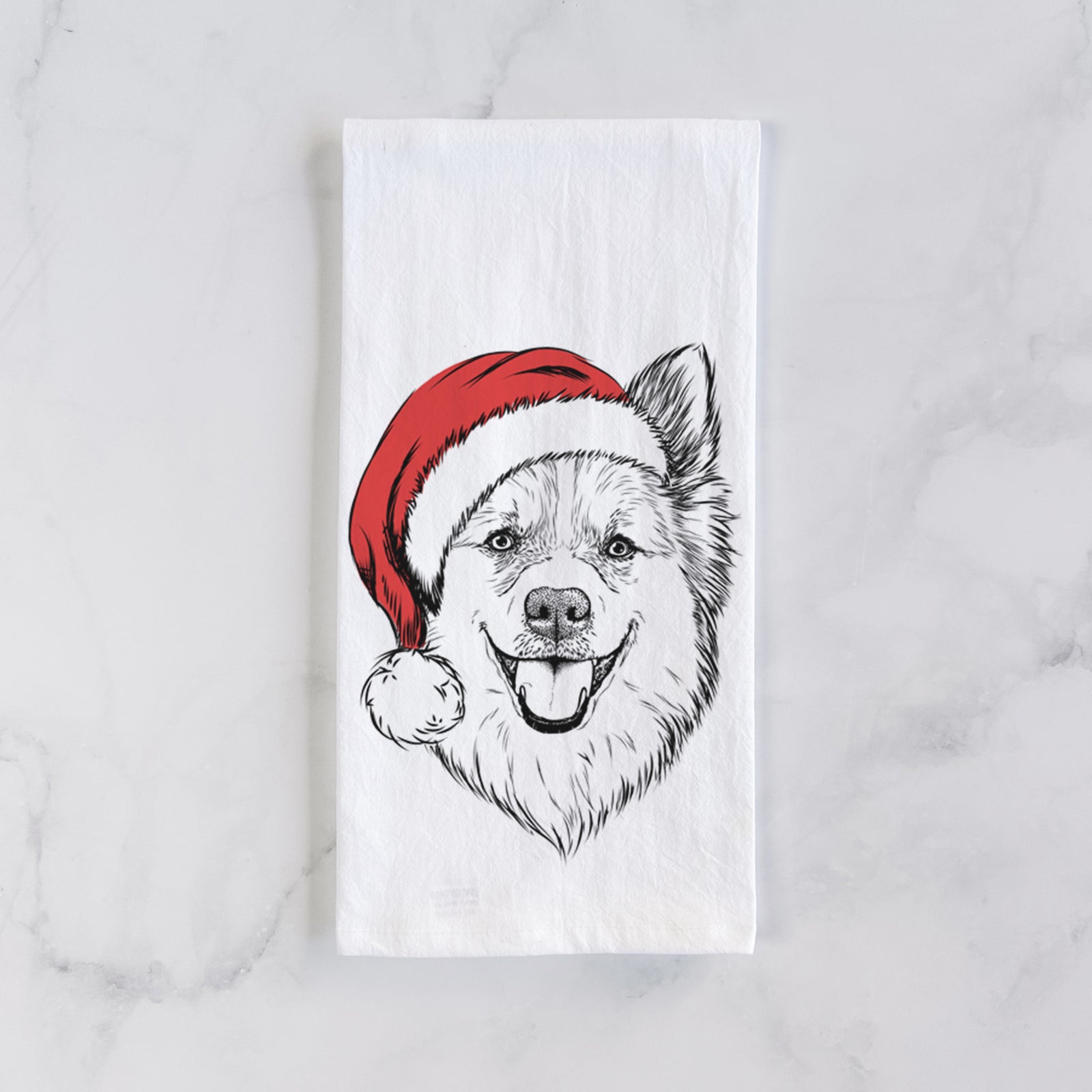 Hand-drawn sketch of Ari the Icelandic Sheepdog wearing a Santa hat on a tea towel