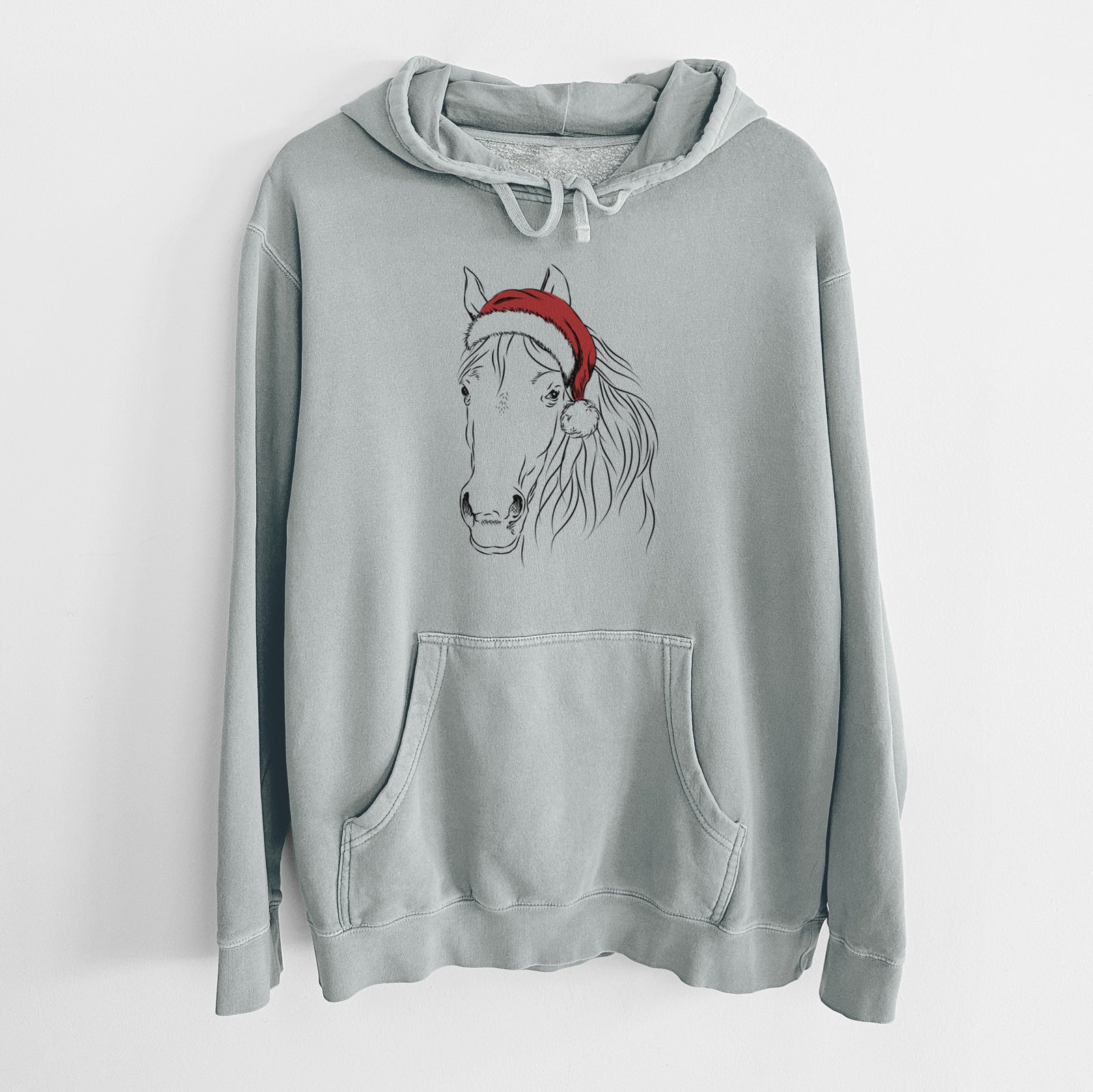 Hand-drawn sketch of Aria the Horse wearing a Santa hat on a Sage Unisex pigment dyed hoodie