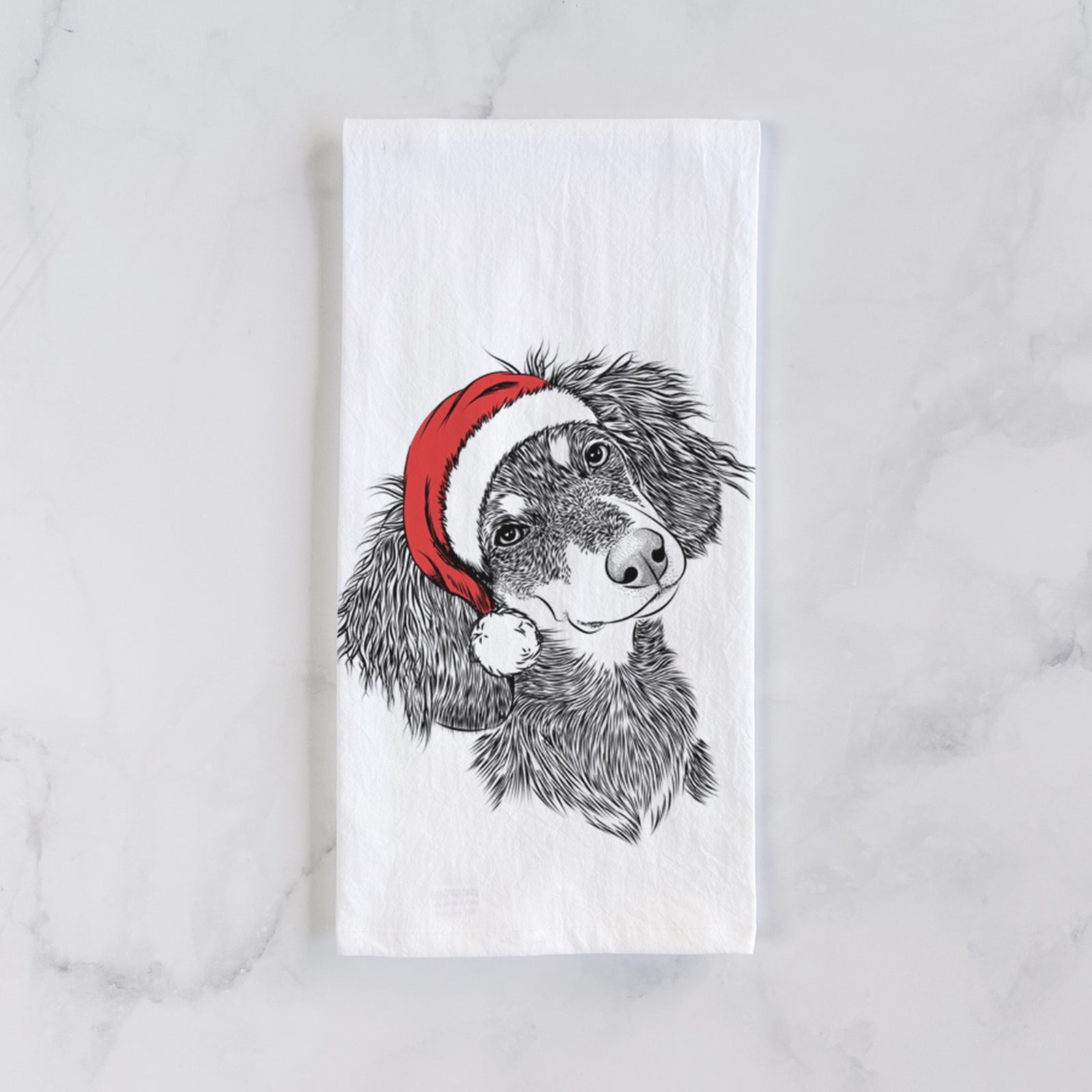 Hand-drawn sketch of Bailey the Long Haired Dachshund wearing a Santa hat on a tea towel