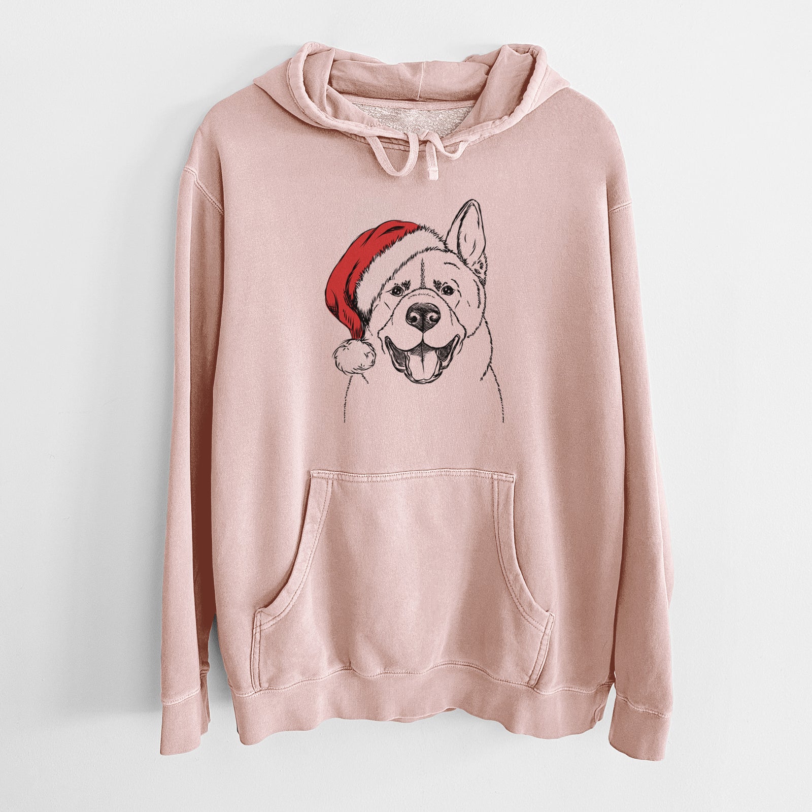 Hand-drawn sketch of Baku the Akita wearing a Santa hat on a Dusty Pink Unisex pigment dyed hoodie