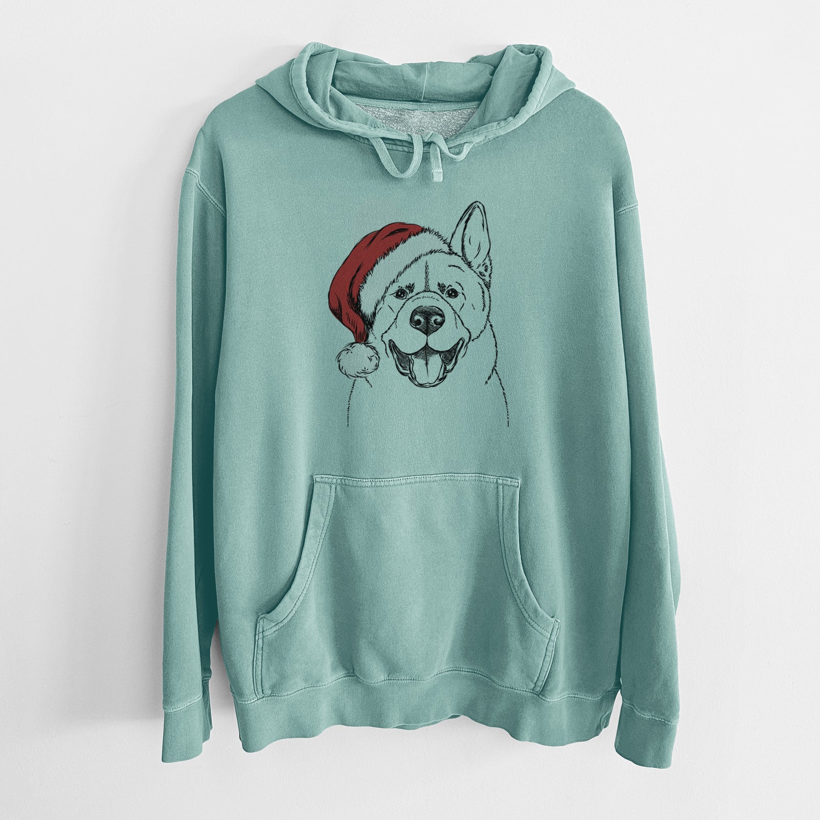 Hand-drawn sketch of Baku the Akita wearing a Santa hat on a Mint Unisex pigment dyed hoodie