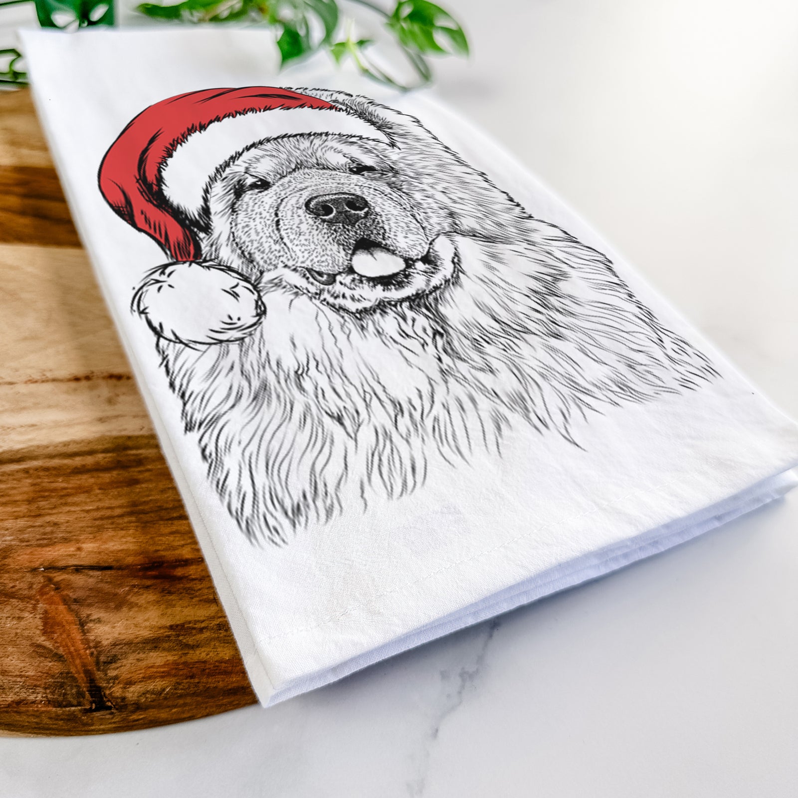 Hand-drawn sketch of Baloo the Chow Chow wearing a Santa hat on a tea towel