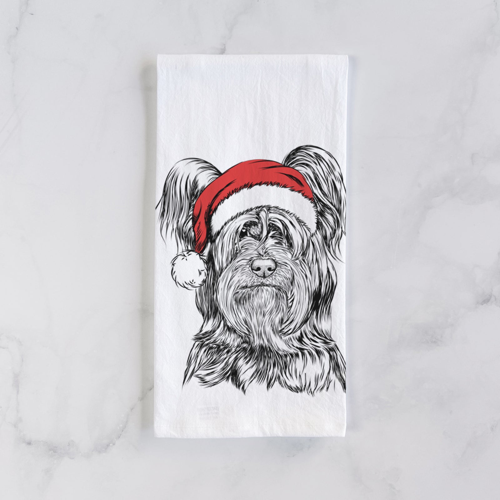 Hand-drawn sketch of Bandit the Skye Terrier wearing a Santa hat on a tea towel