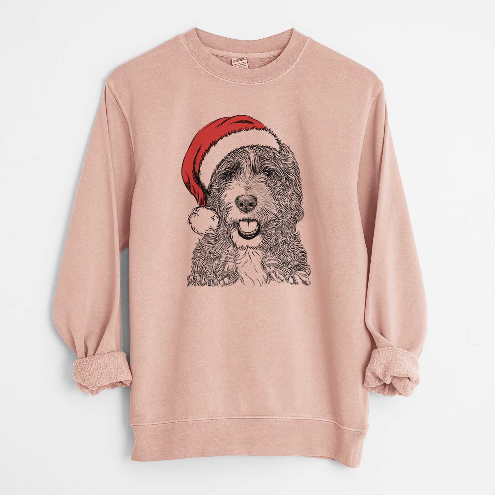 Hand-drawn sketch of Bash the Bernedoodle wearing a Santa hat on a Dusty Pink Unisex pigment dyed crew sweatshirt