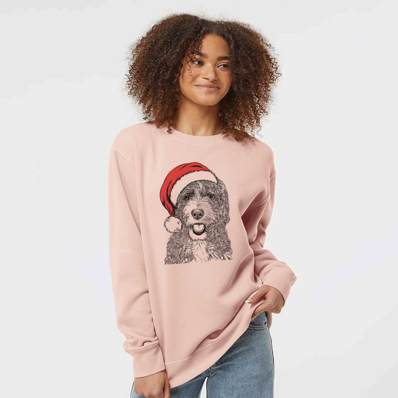 Hand-drawn sketch of Bash the Bernedoodle wearing a Santa hat on a Dusty Pink Unisex pigment dyed crew sweatshirt