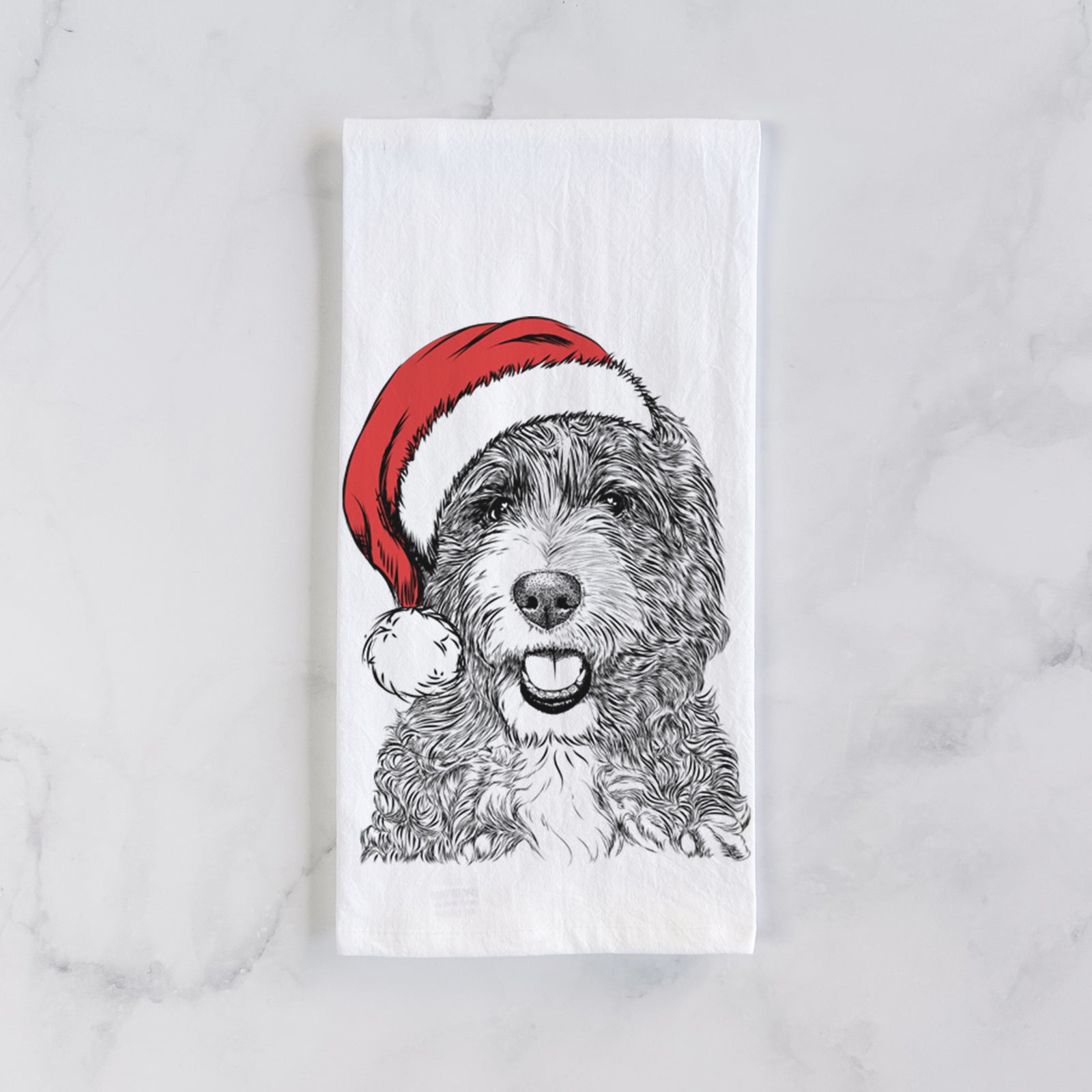 Hand-drawn sketch of Bash the Bernedoodle wearing a Santa hat on a tea towel