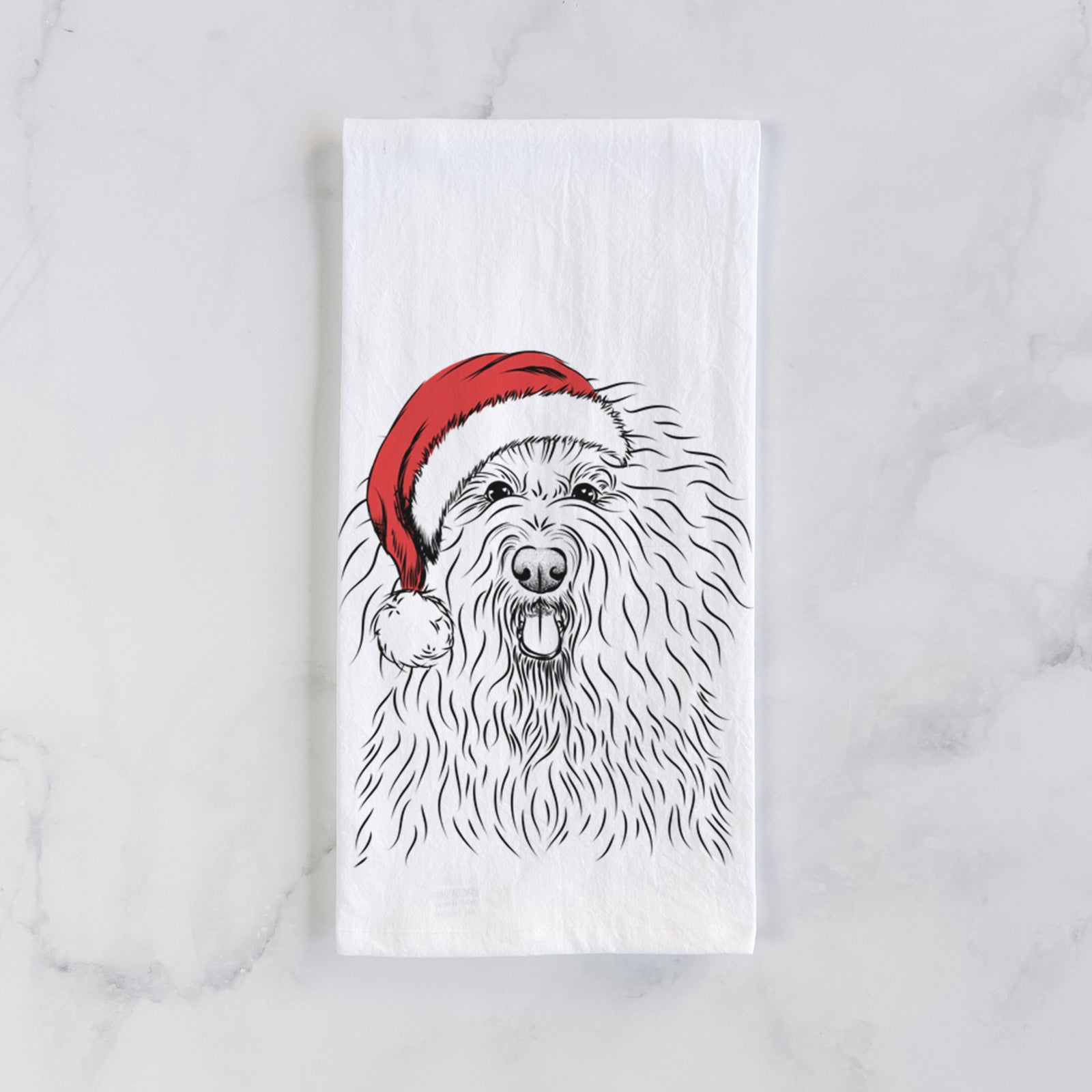 Hand-drawn sketch of Brody the Old English Sheepdog wearing a Santa hat on a tea towel
