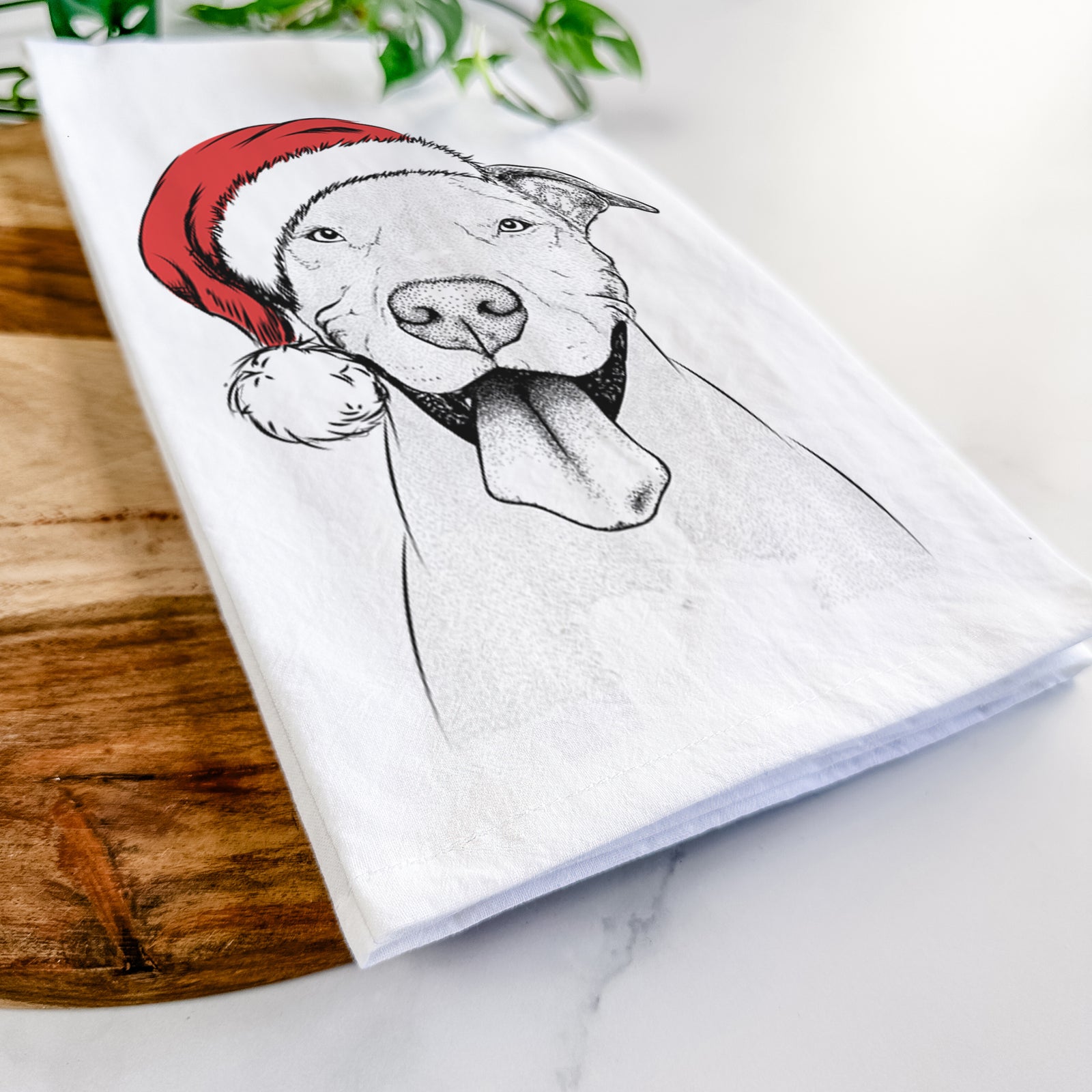 Hand-drawn sketch of Bruce the American Staffordshire Terrier wearing a Santa hat on a tea towel