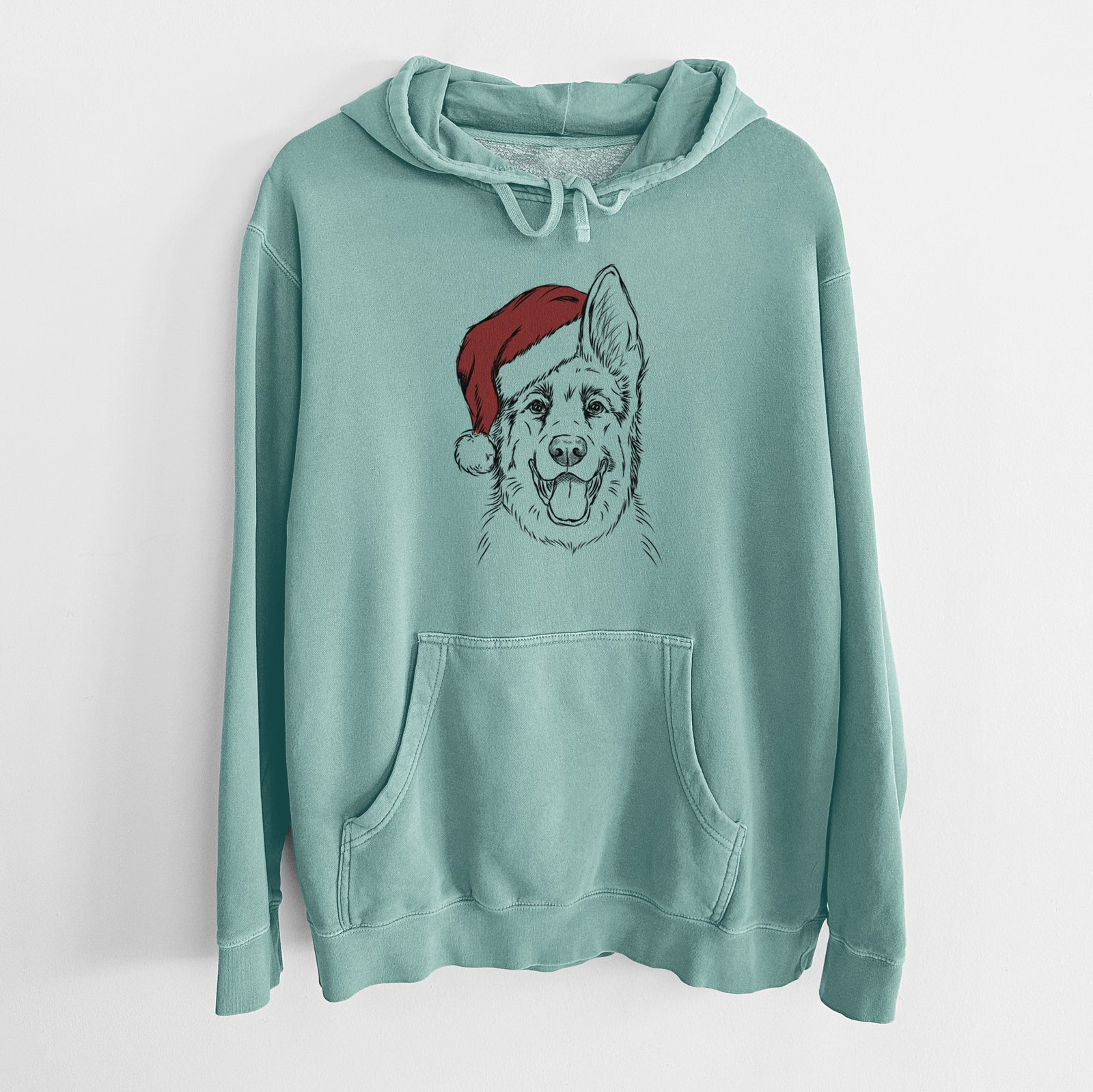 Hand-drawn sketch of Brutus the German Shepherd wearing a Santa hat on a Mint Unisex pigment dyed hoodie