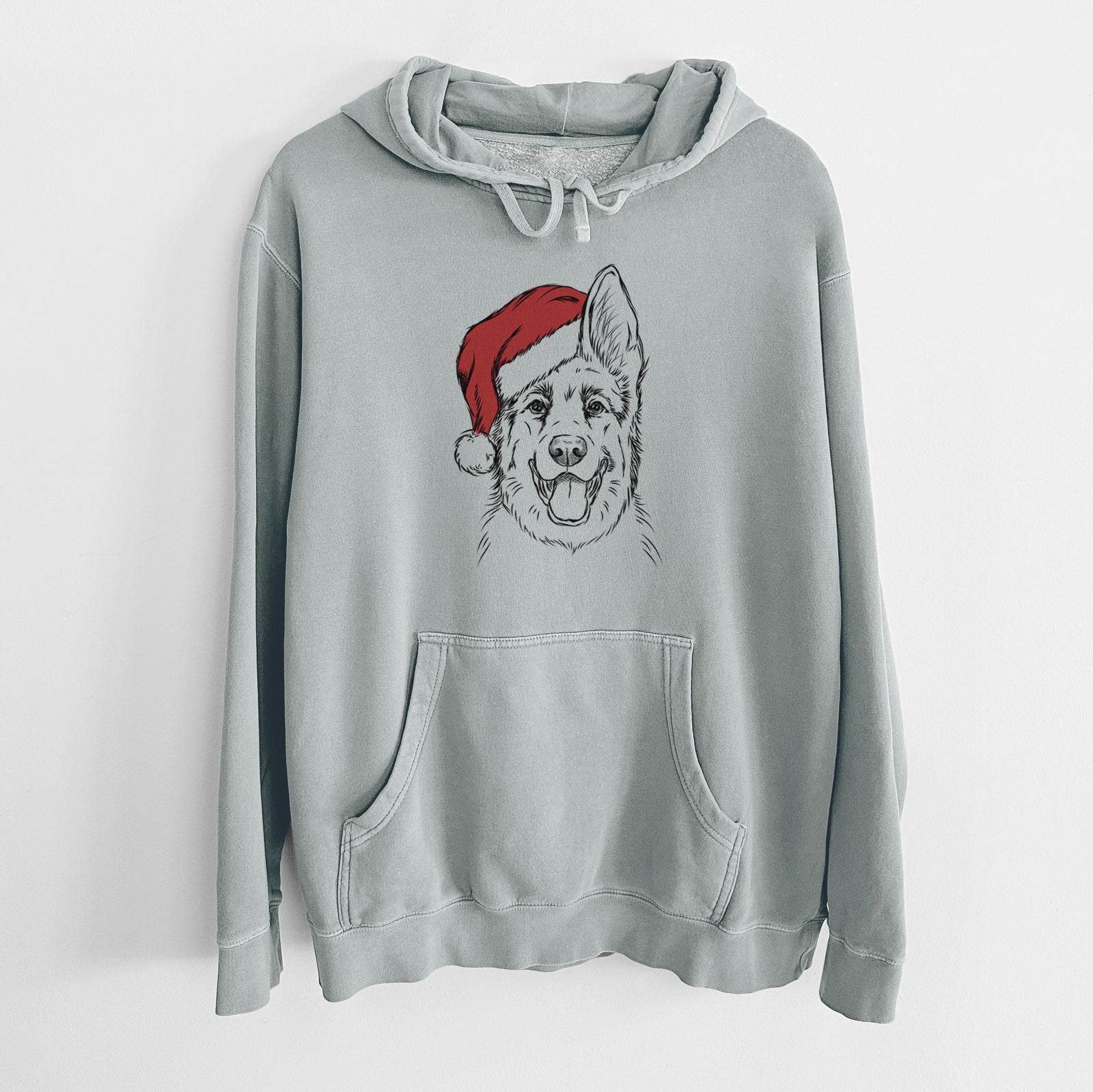 Hand-drawn sketch of Brutus the German Shepherd wearing a Santa hat on a Sage Unisex pigment dyed hoodie