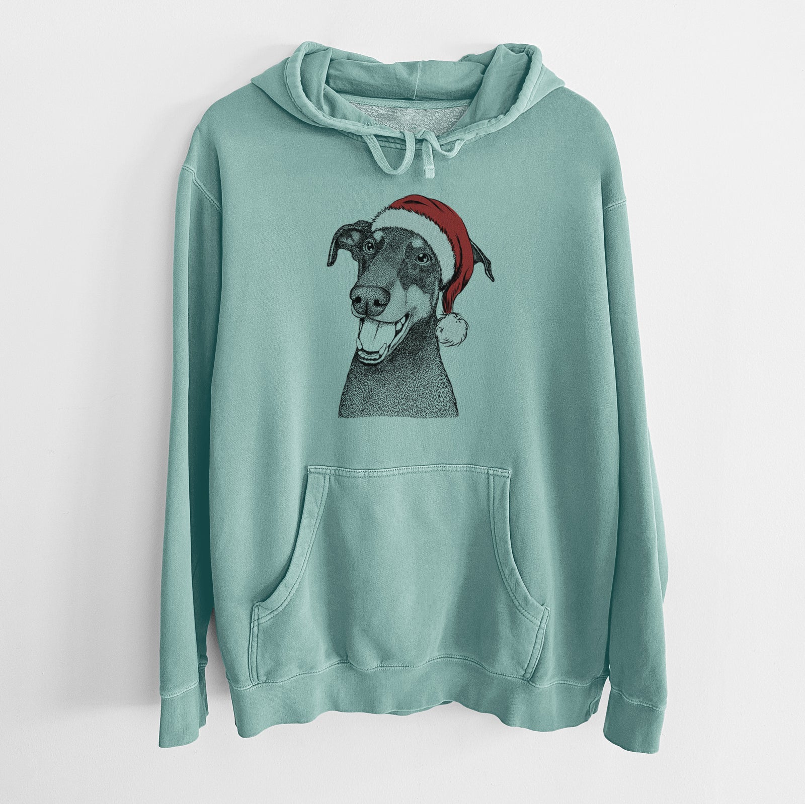 Hand-drawn sketch of Bunnie the Doberman Pinscher wearing a Santa hat on a Mint Unisex pigment dyed hoodie
