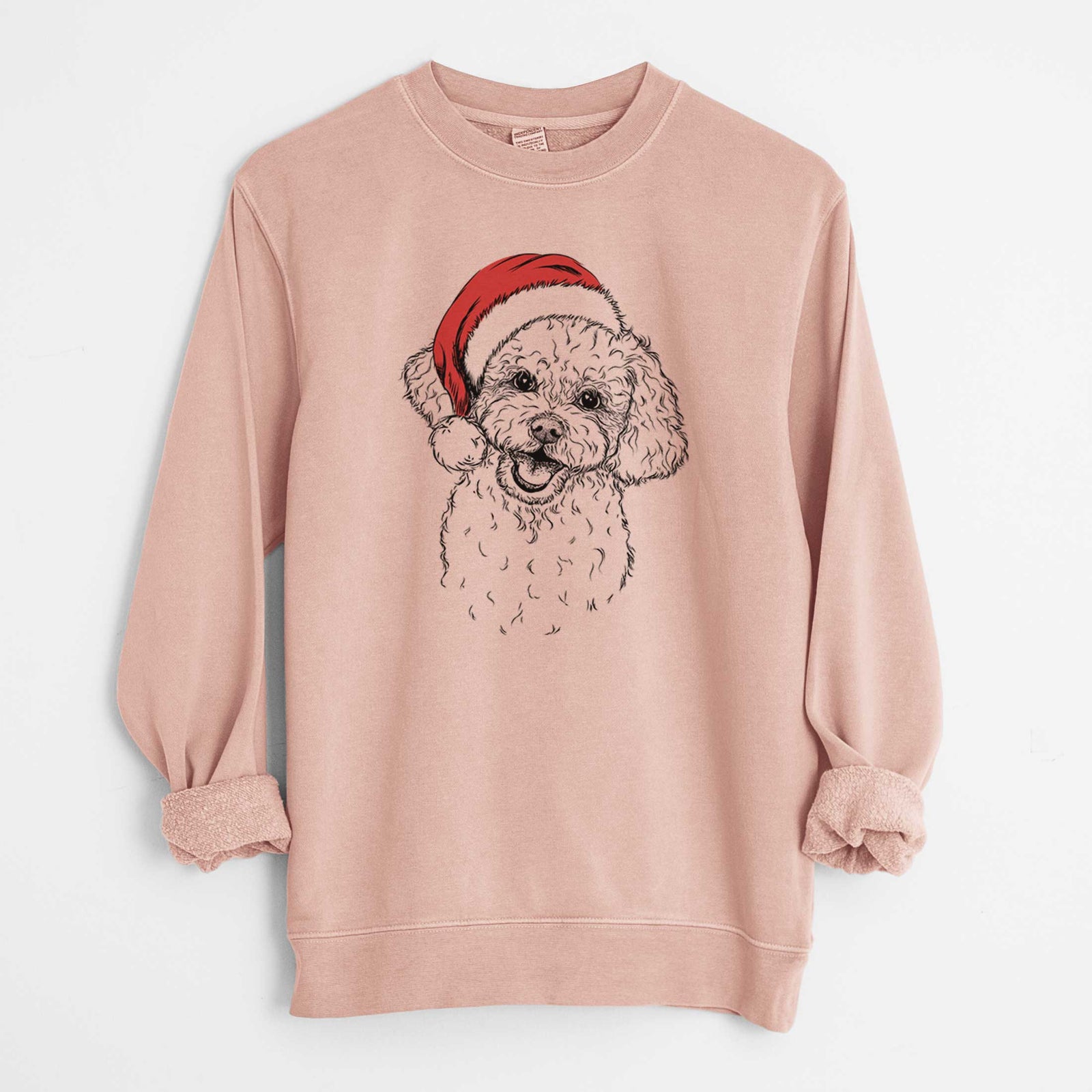 Hand-drawn sketch of Caesar the Bichon Frise wearing a Santa hat on a Dusty Pink Unisex pigment dyed crew sweatshirt