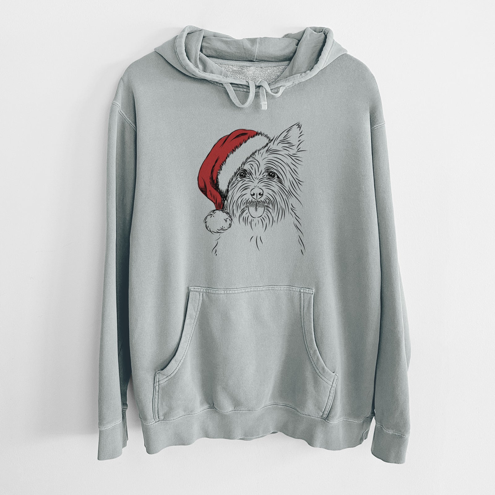 Hand-drawn sketch of Calum the Cairn Terrier wearing a Santa hat on a Sage Unisex pigment dyed hoodie
