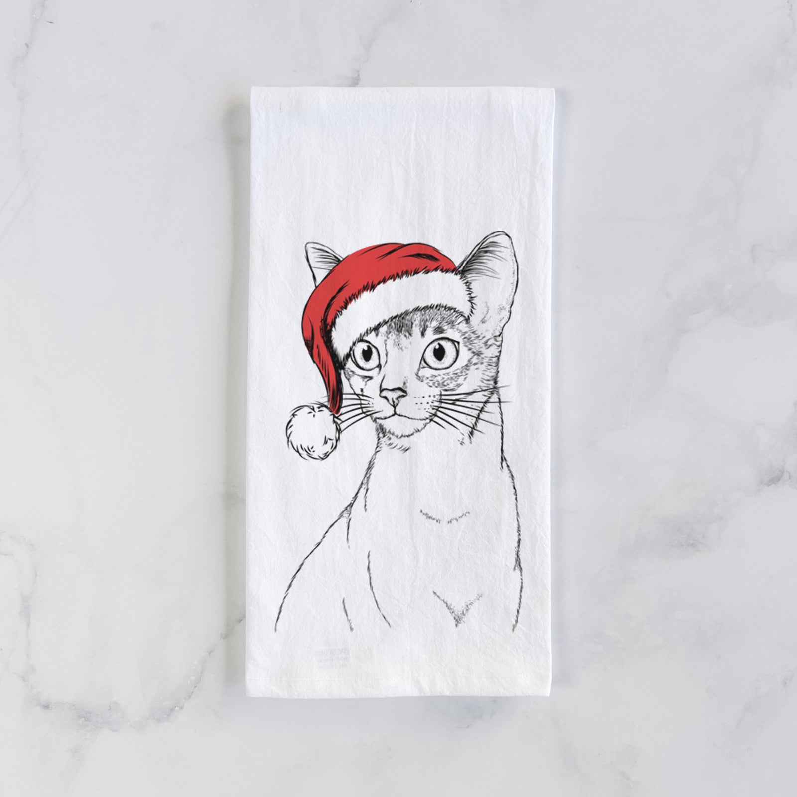 Hand-drawn sketch of Cedric the Abyssinian Cat wearing a Santa hat on a tea towel