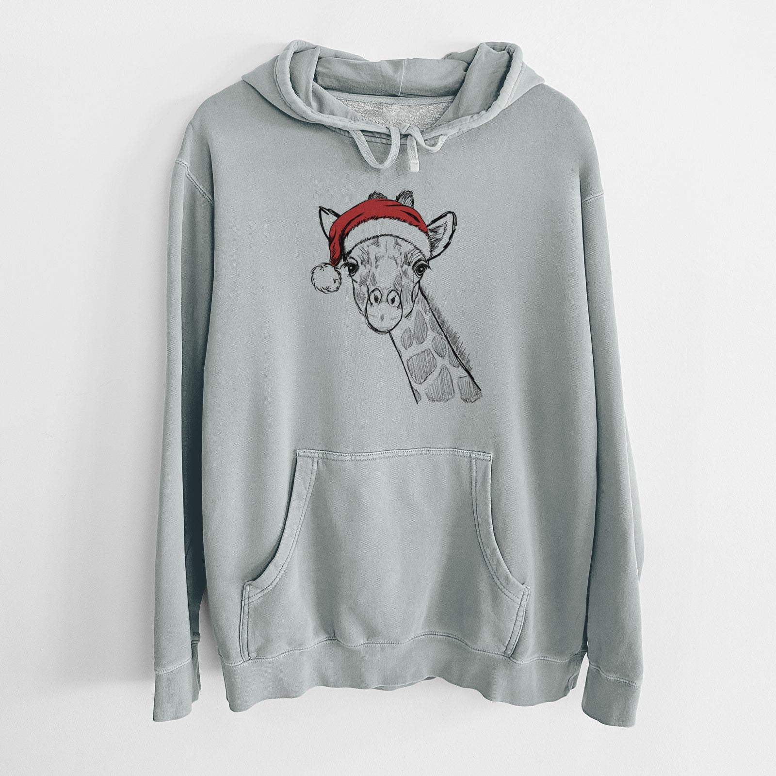 Hand-drawn sketch of Cedrick the Giraffe wearing a Santa hat on a Sage Unisex pigment dyed hoodie