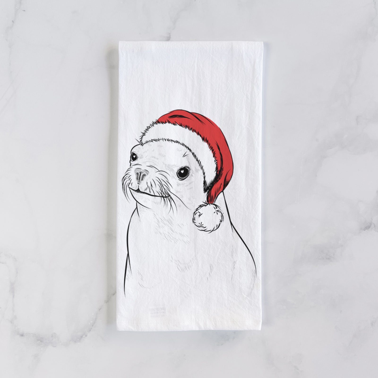 Hand-drawn sketch of Chip the California Sea Lion wearing a Santa hat on a tea towel