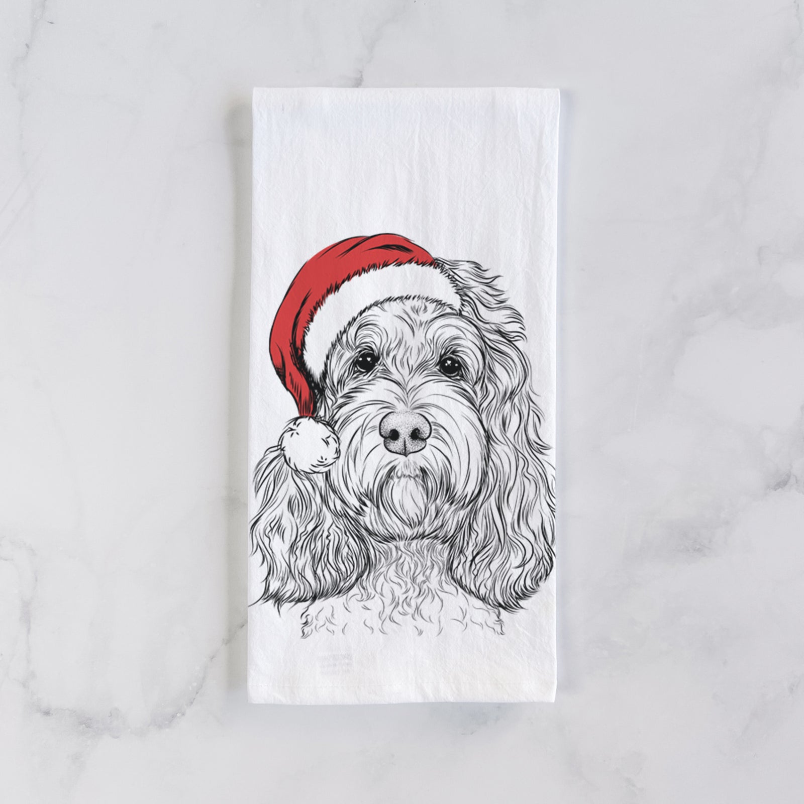 Hand-drawn sketch of Chloe the Cockapoo wearing a Santa hat on a tea towel