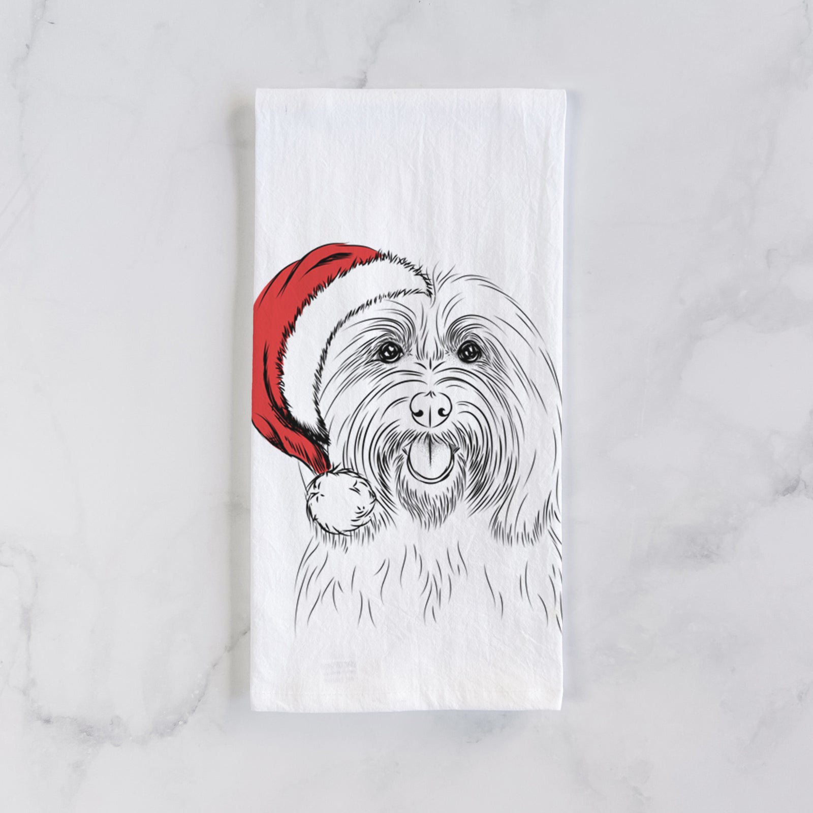 Hand-drawn sketch of Claude the Coton de Tulear wearing a Santa hat on a tea towel