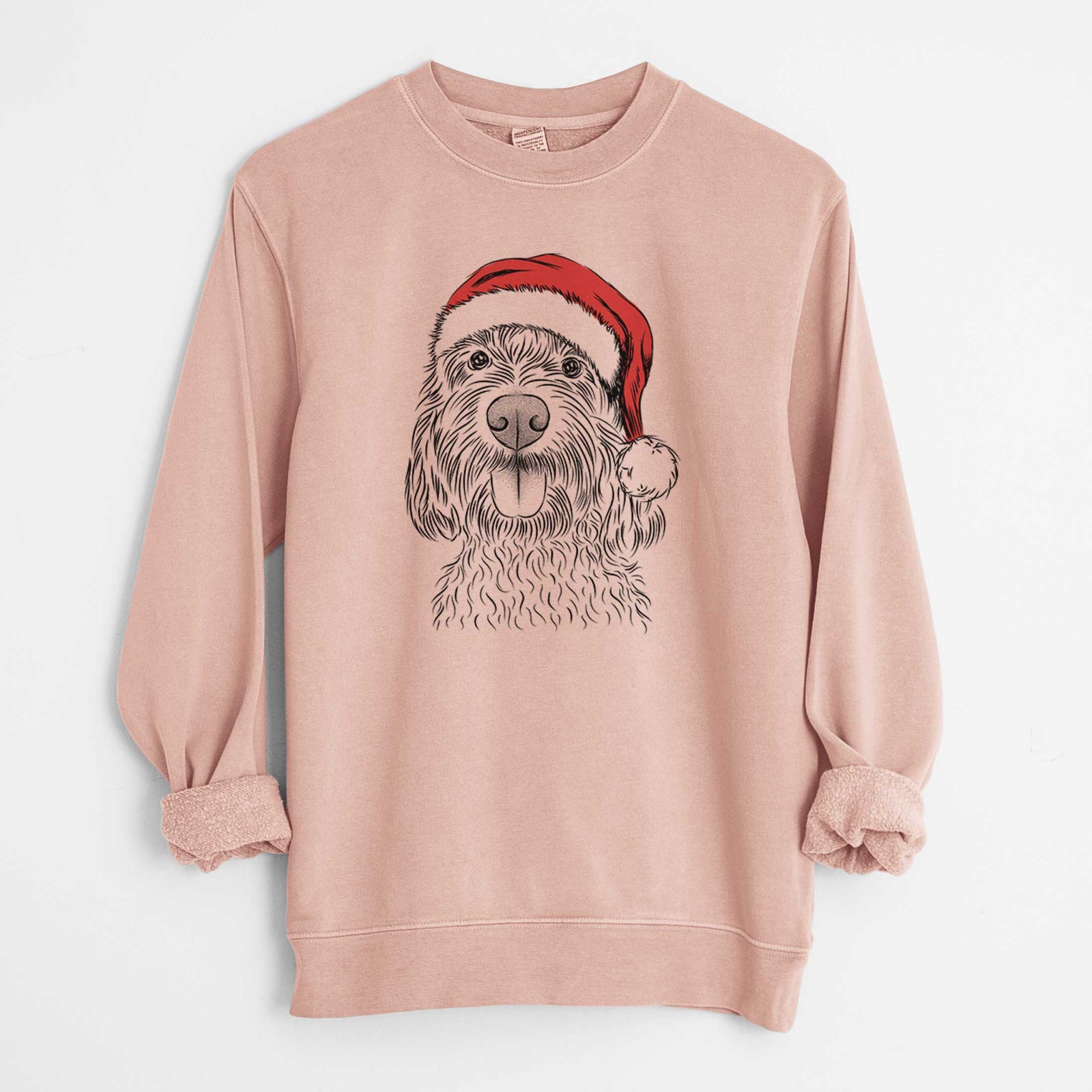 Hand-drawn sketch of Clover the Cockapoo wearing a Santa hat on a Dusty Pink Unisex pigment dyed crew sweatshirt