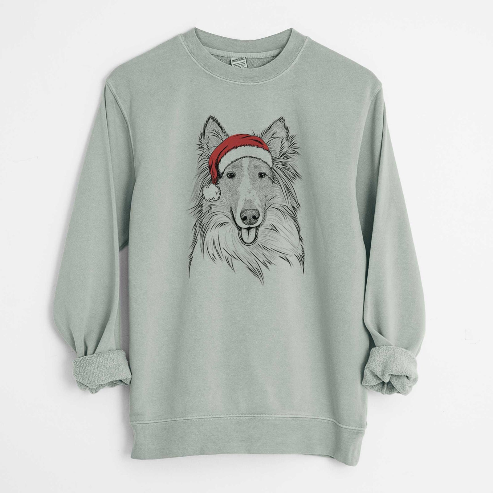 Hand-drawn sketch of Conrad the Rough Collie wearing a Santa hat on a Sage Unisex pigment dyed crew sweatshirt