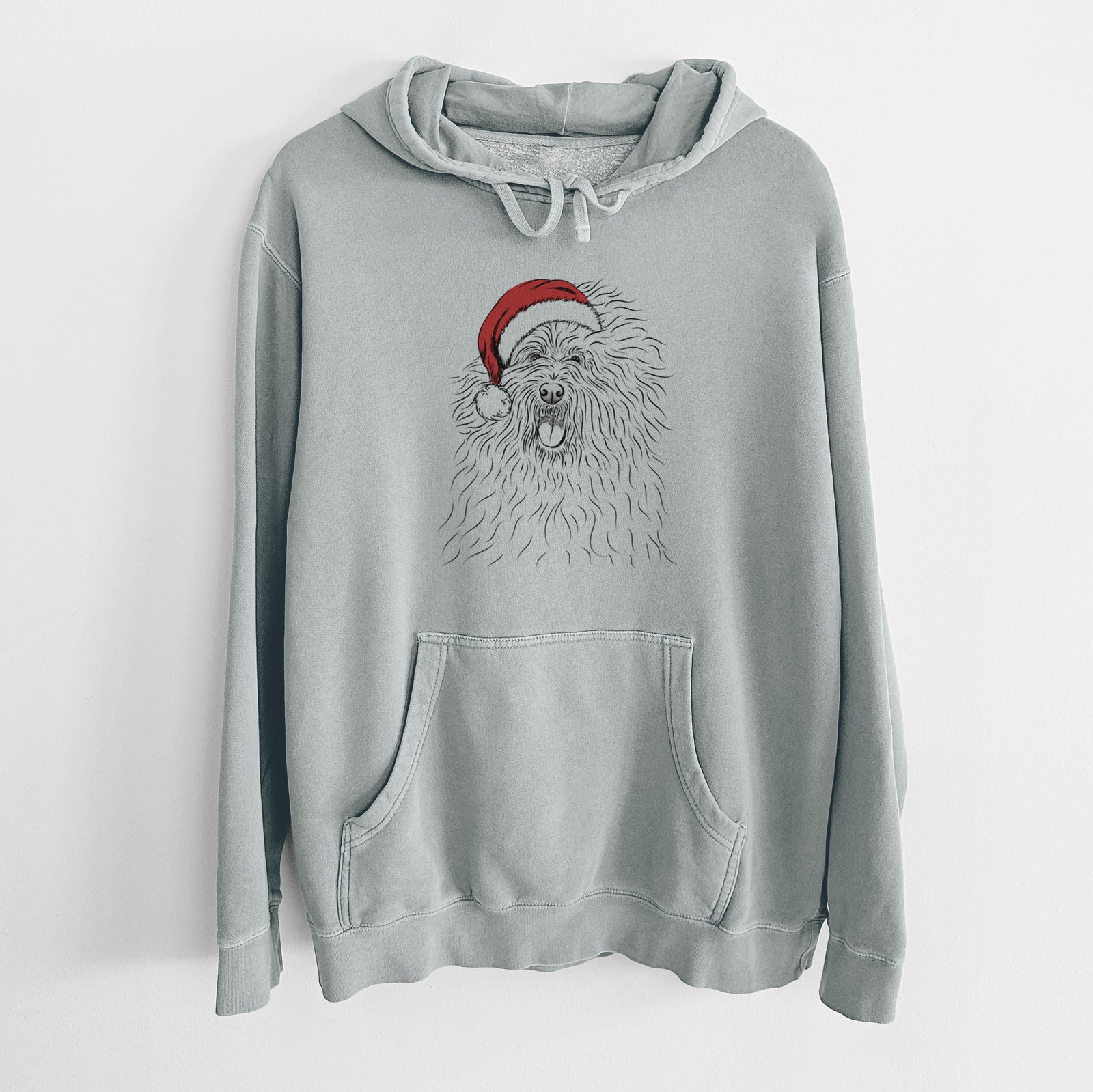 Hand-drawn sketch of Cozie the Old English Sheepdog wearing a Santa hat on a Sage Unisex pigment dyed hoodie