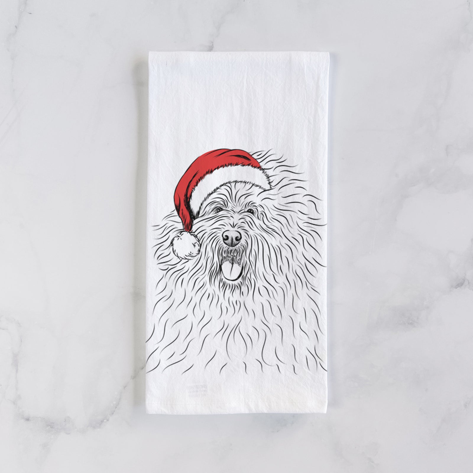 Hand-drawn sketch of Cozie the Old English Sheepdog wearing a Santa hat on a tea towel