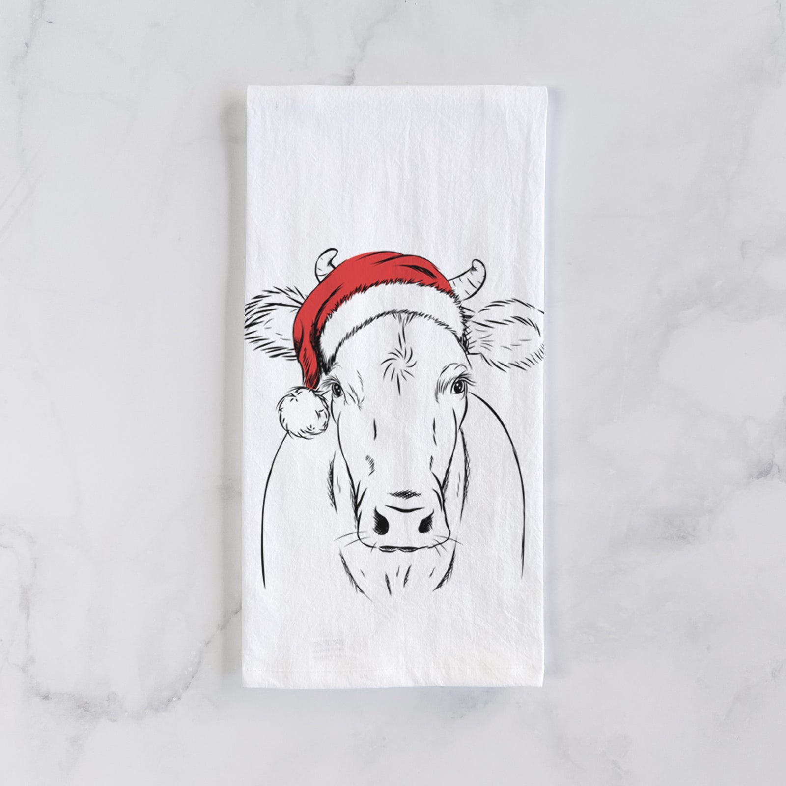 Hand-drawn sketch of Cruz the Cow wearing a Santa hat on a tea towel